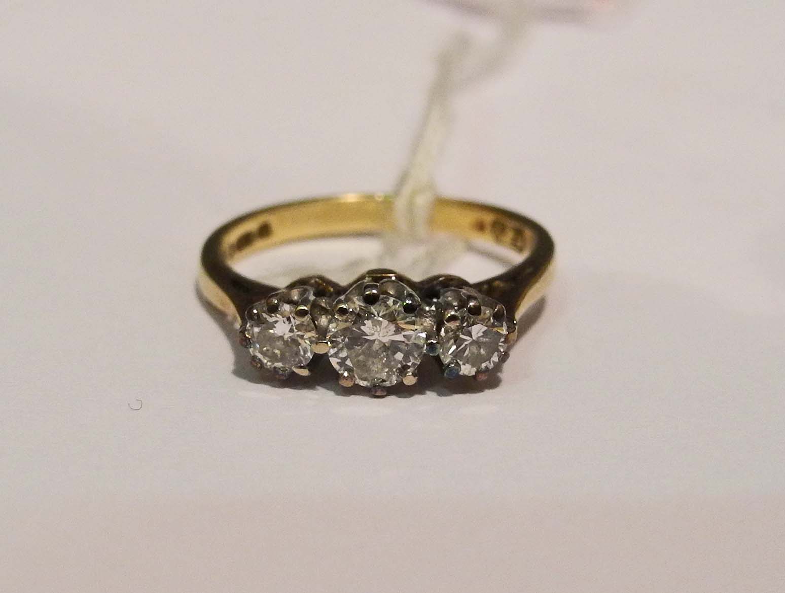 A vintage 18ct yellow gold and diamond set graduated three stone ring.