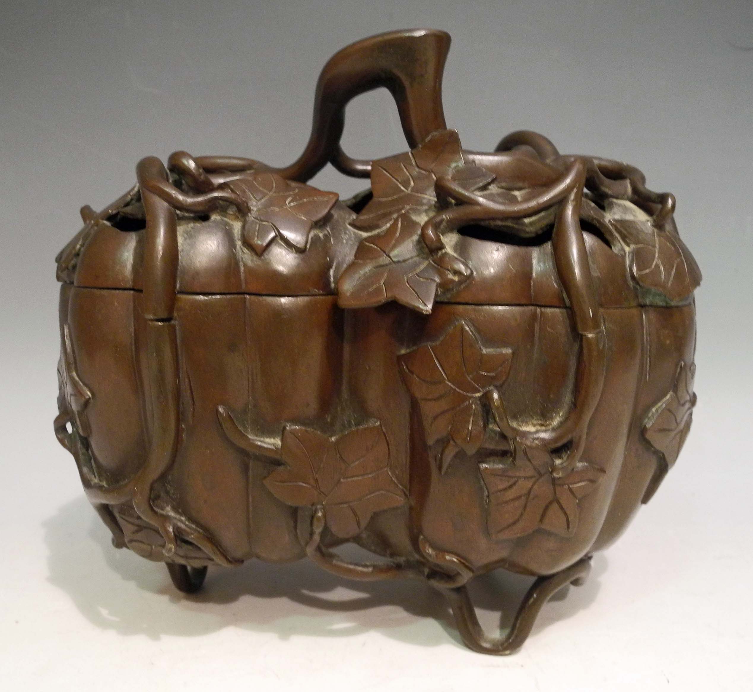 A Chinese early 20th Century bronze censer, with double lobes of pumpkin form, applied fruit of