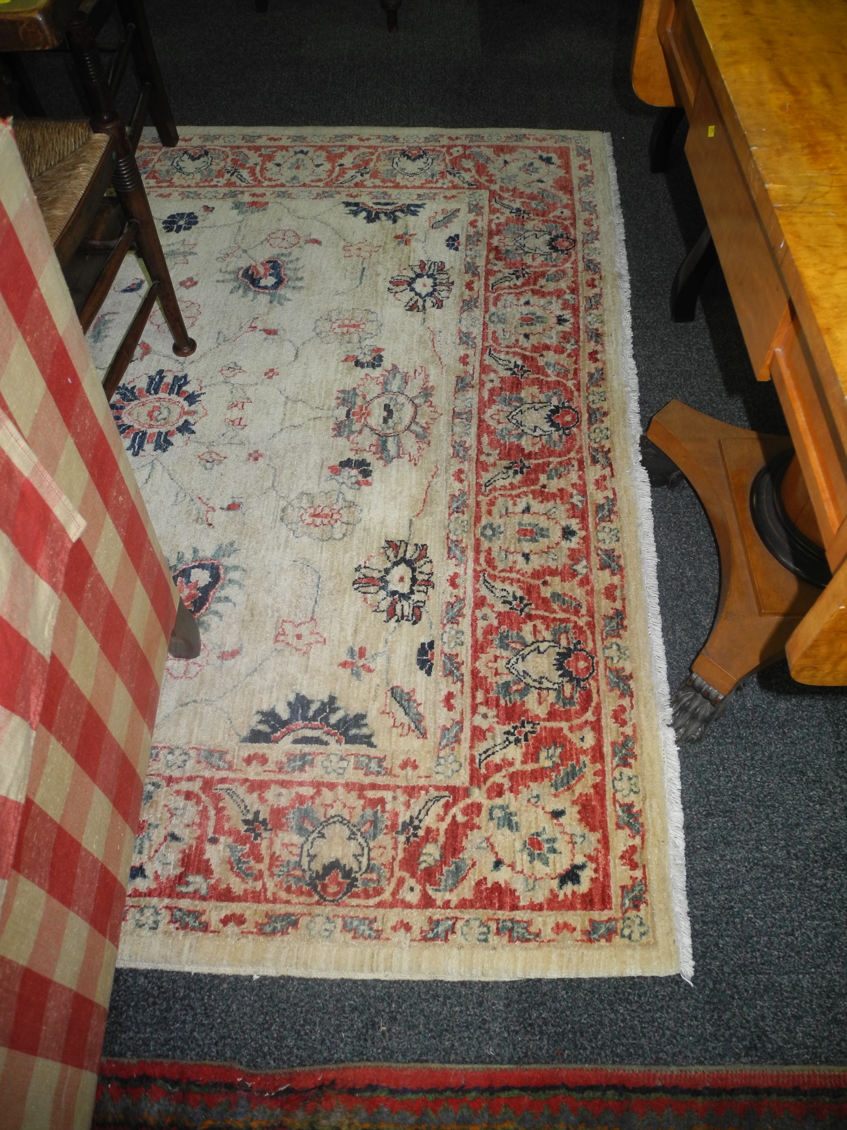 A very fine Pakistan rug, with all over forms and an antique ivory field within a faded rose