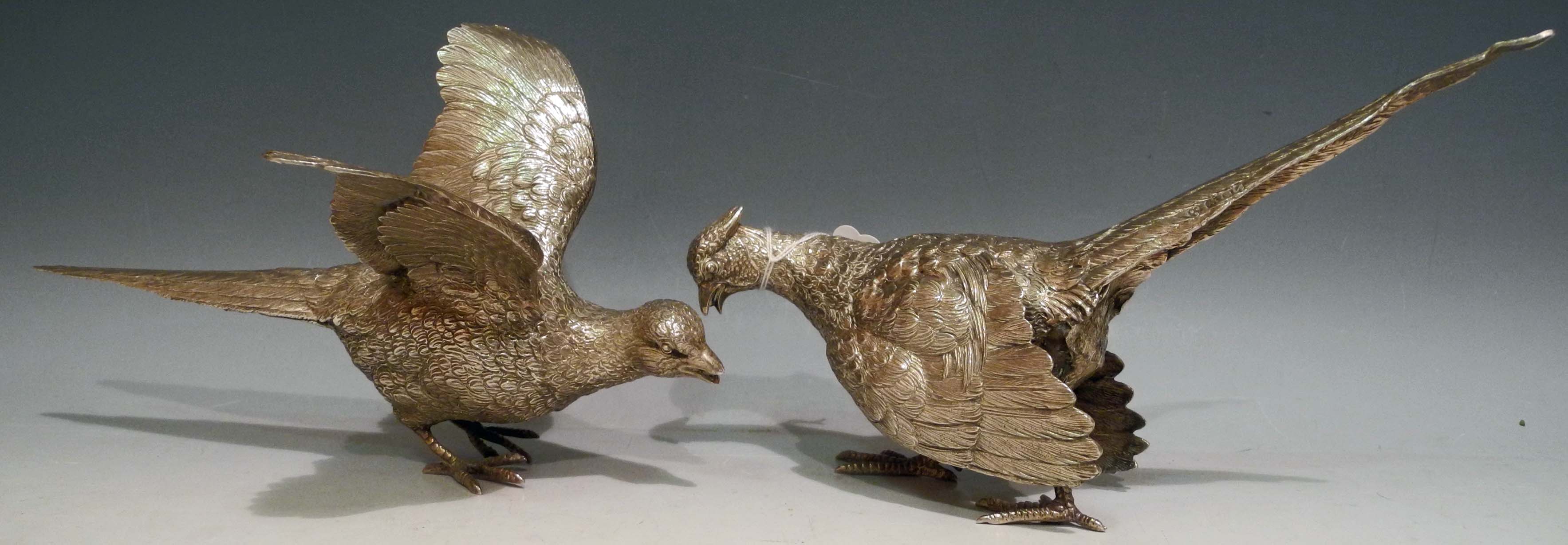 A pair of silver pheasants, cock and hen birds, in naturalistic poses, D J Silvers mark, London