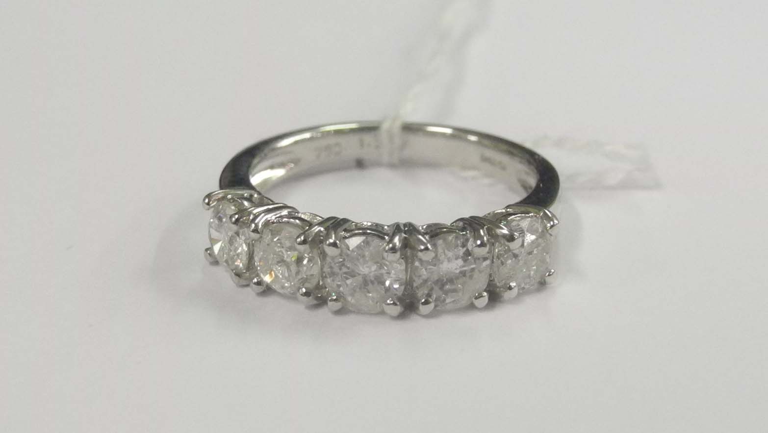 An 18ct white gold and diamond set five stone ring (1.5cts).