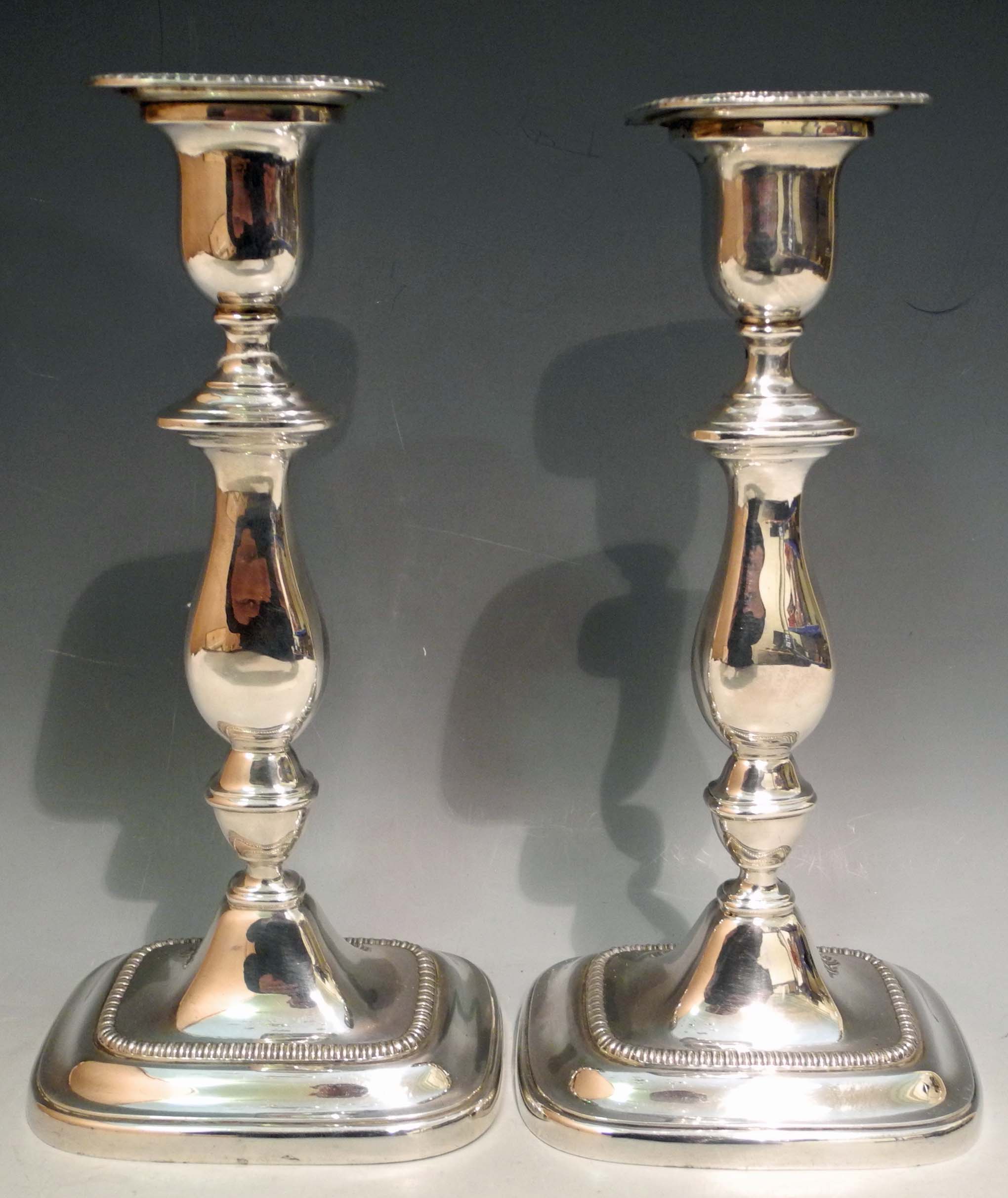 A pair of contemporary silver candlesticks, with gadrooned decoration, Sheffield 1960. (2)23.5cm,