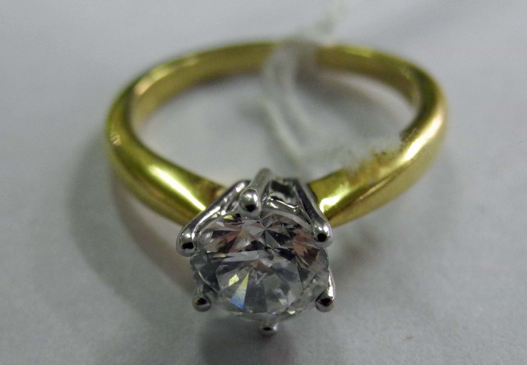 An 18ct yellow gold 1ct diamond solitaire ring (approx E colour).