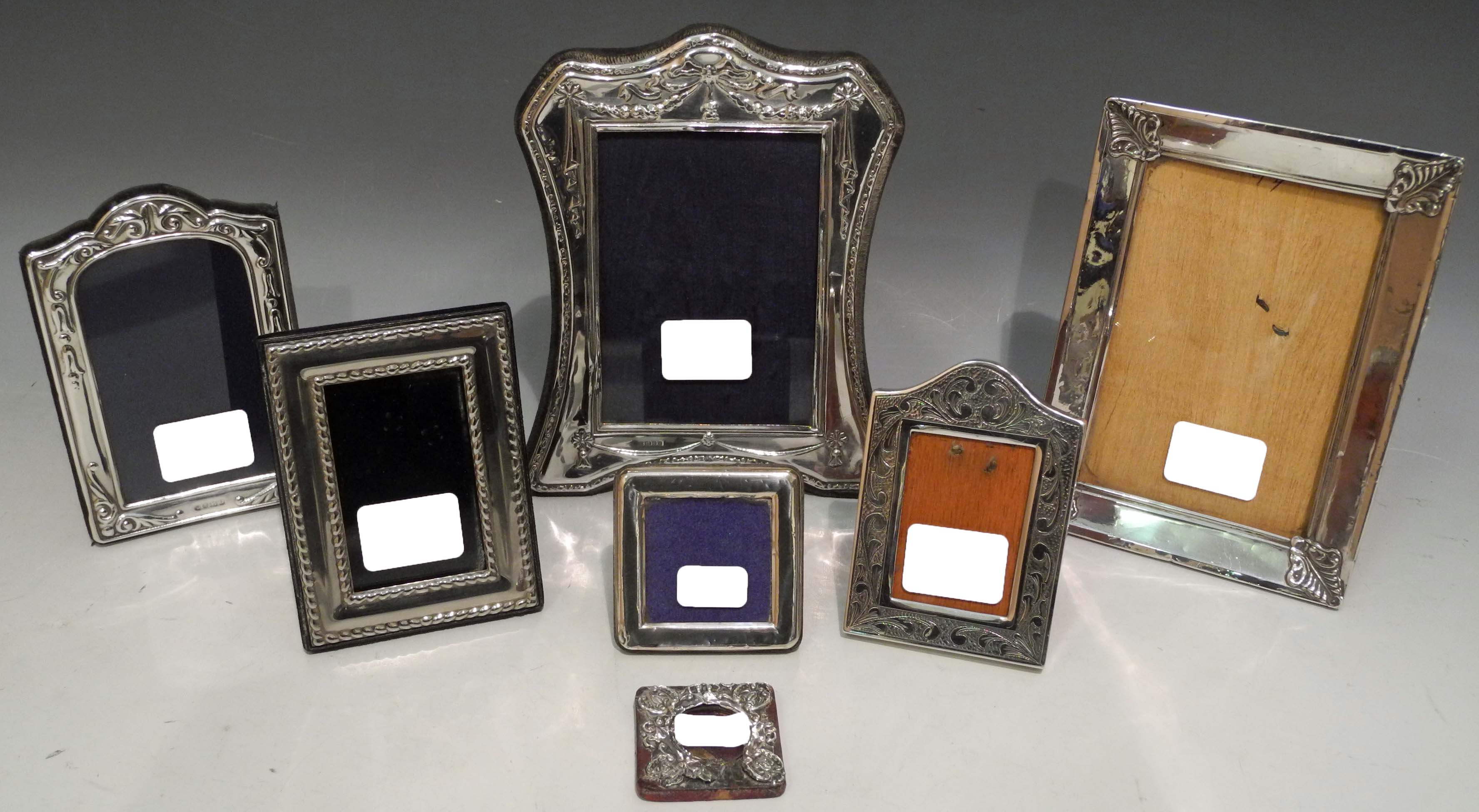 A selection of seven 20th Century hallmarked and sterling silver photograph frames, some having