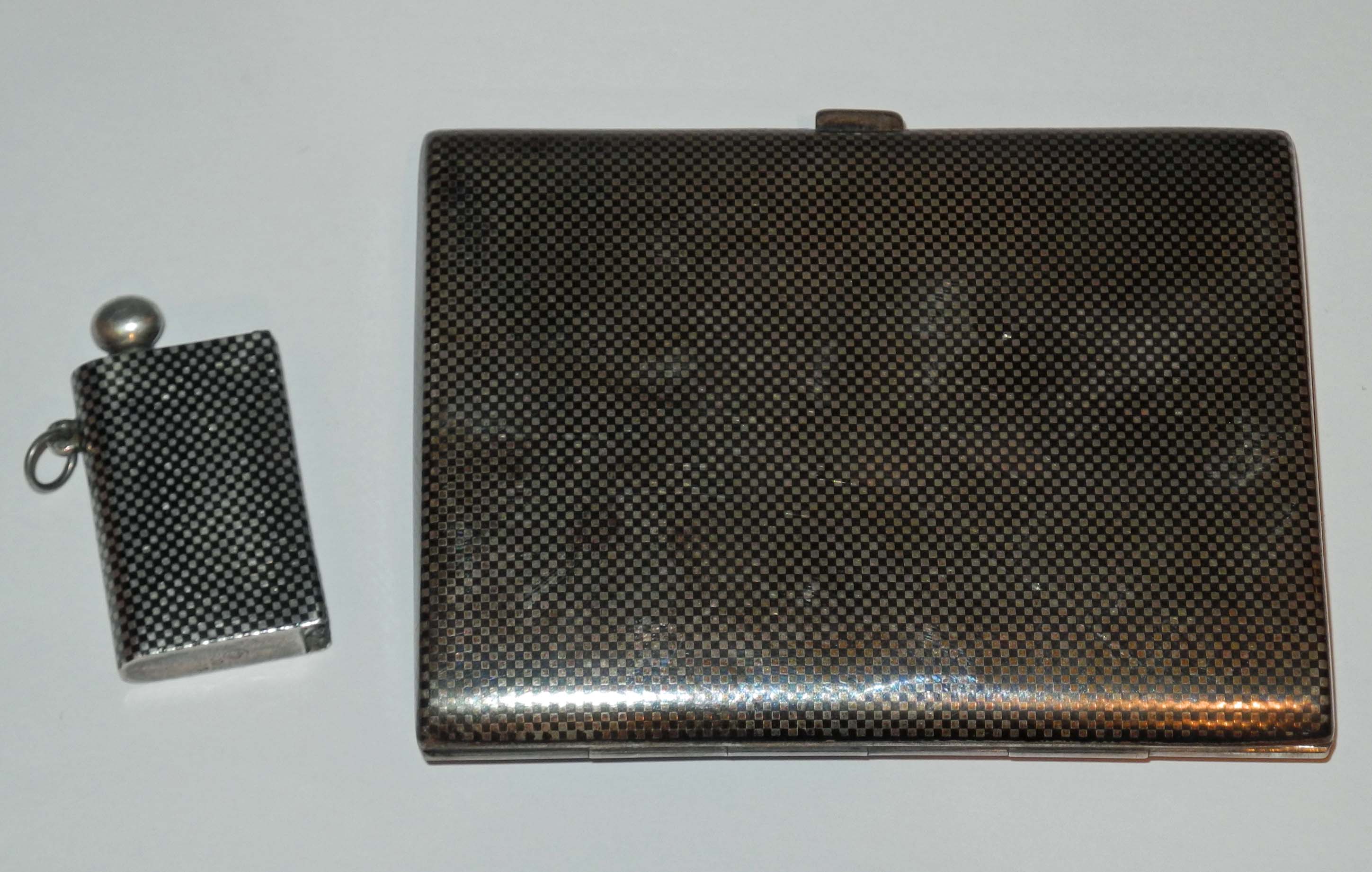 A vintage .900 silver cigarette case, with niello chequered decoration and sold together with