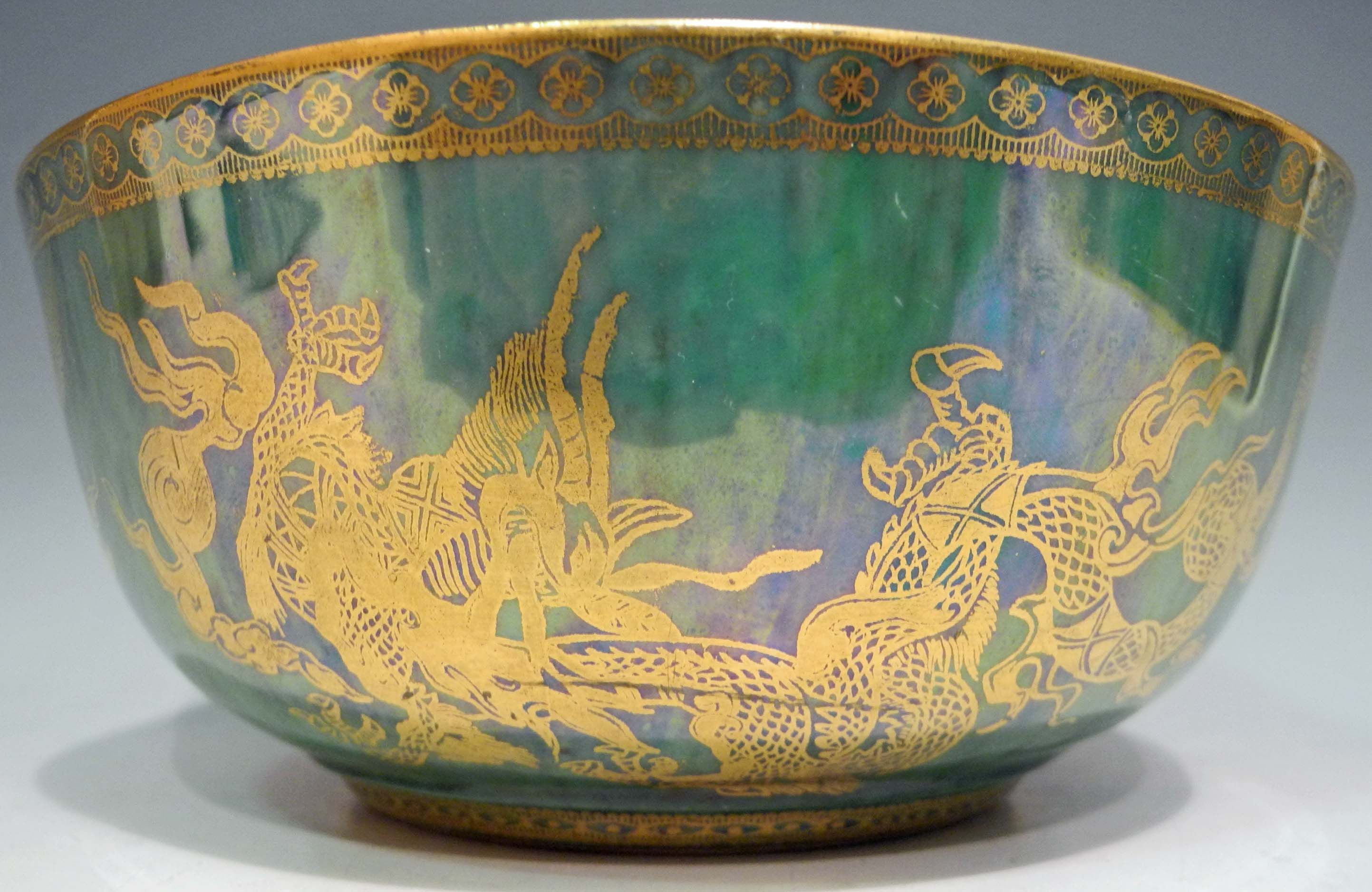 A Wedgwood lustre bowl, with decoration of gilt Chinese garden, bridge to inner rim, `jewels` to