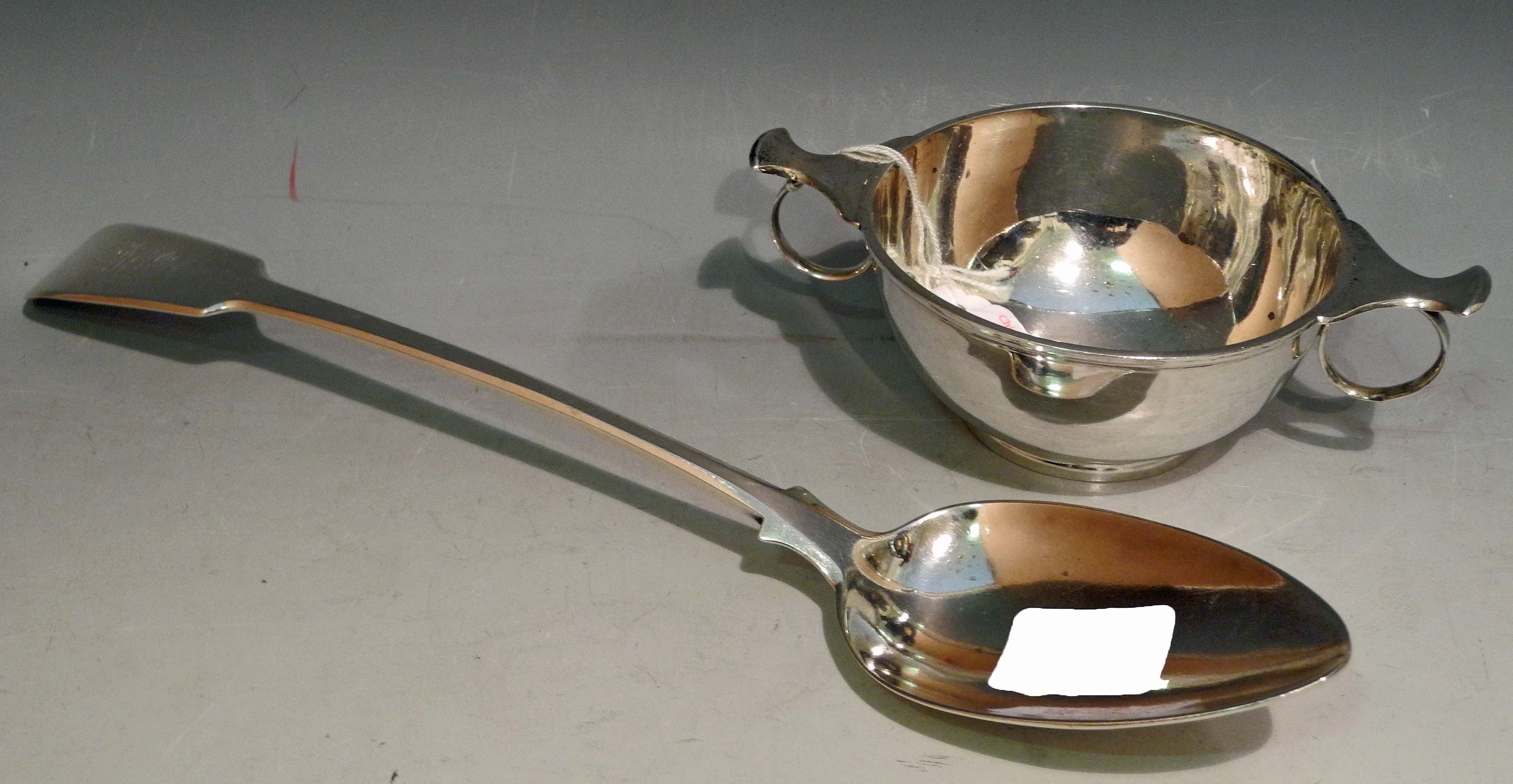 A hallmarked silver quaich (Birmingham 1943), sold together with a Georgian silver basting spoon (
