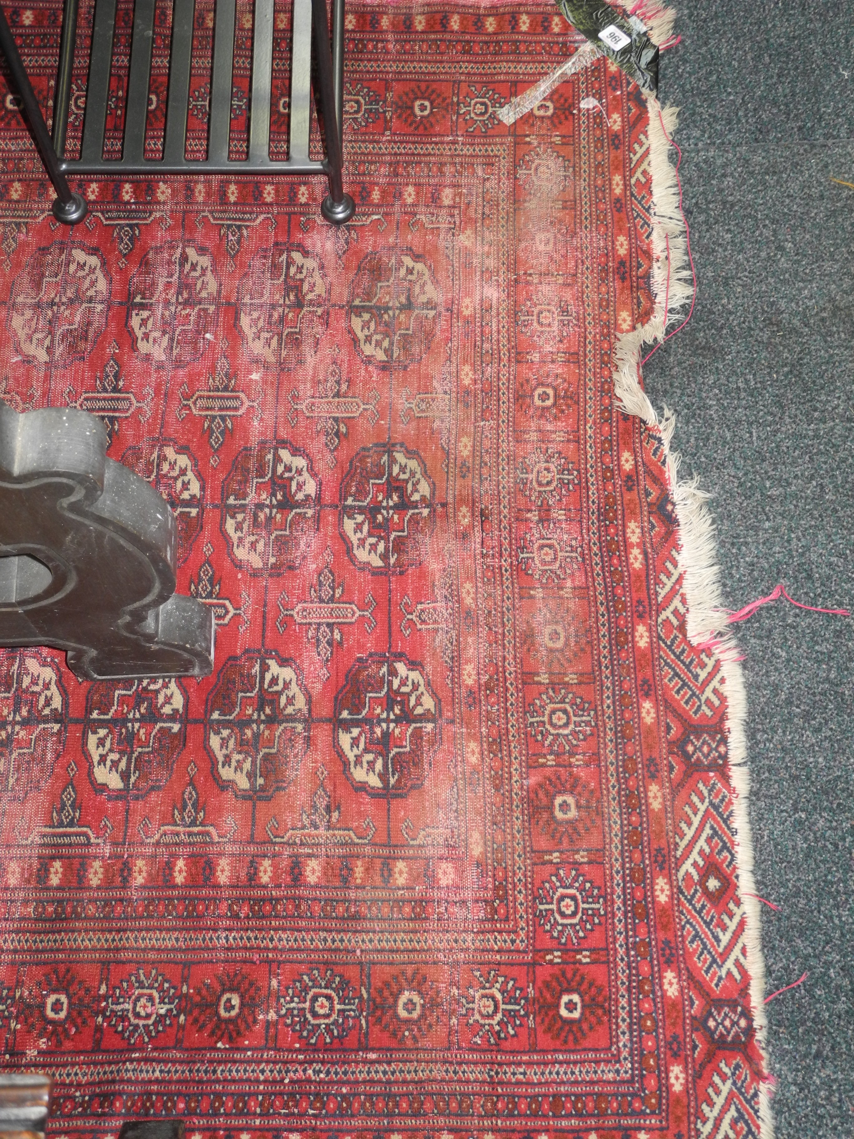 A late 19th Century Bokhara carpet, the red ground decorated with geometric medallions (157cm x
