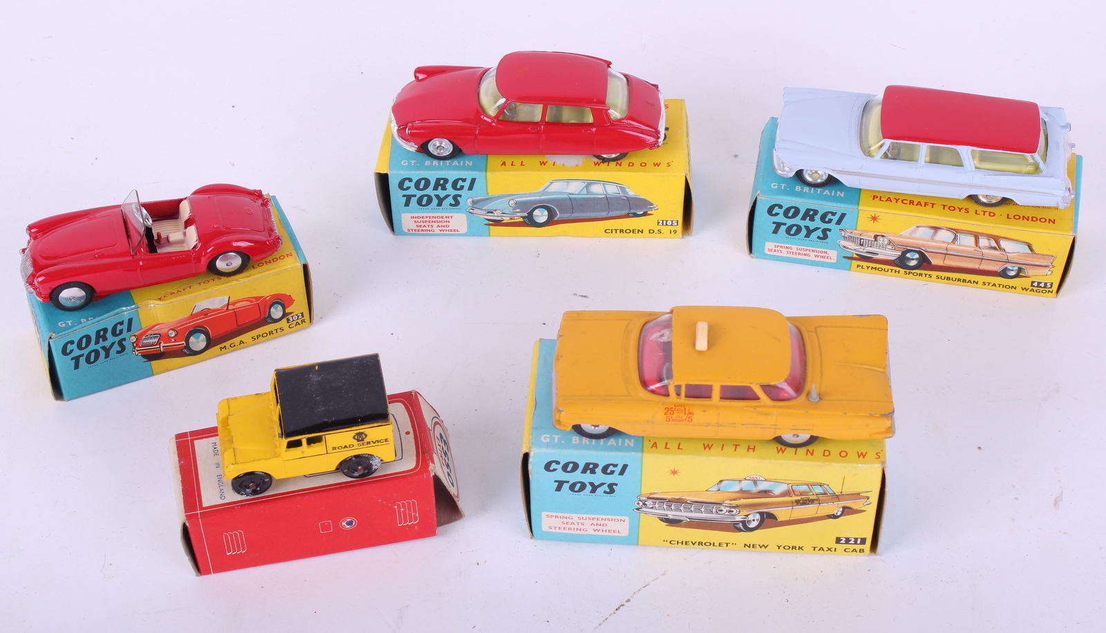 Four boxed Corgi Toys including ra red MGA sports car 302, `Chevrolet` New York taxi cab 221,