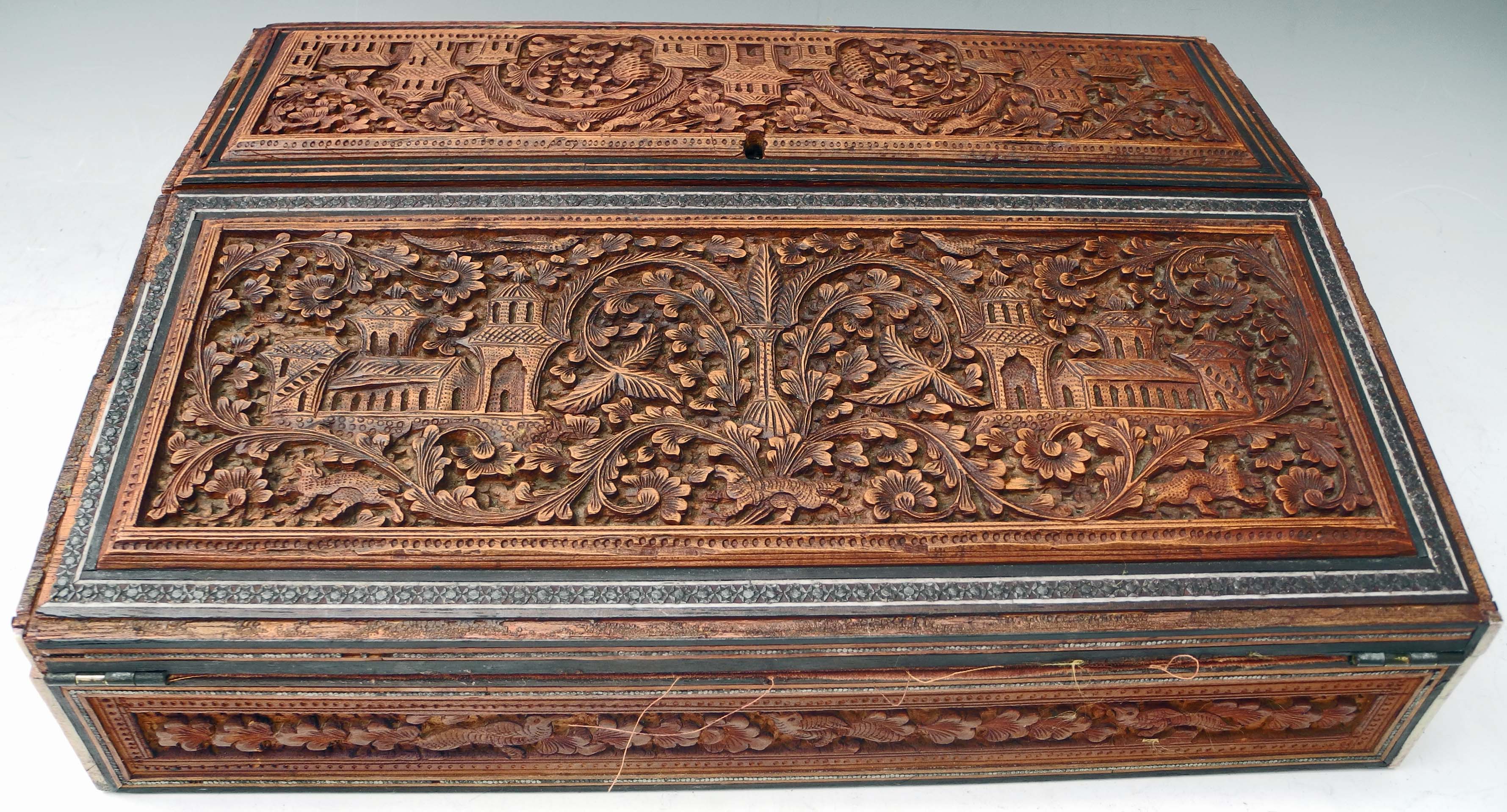 A 19th Century Anglo-Indian sandalwood travelling stationery box and cover, opening to reveal a