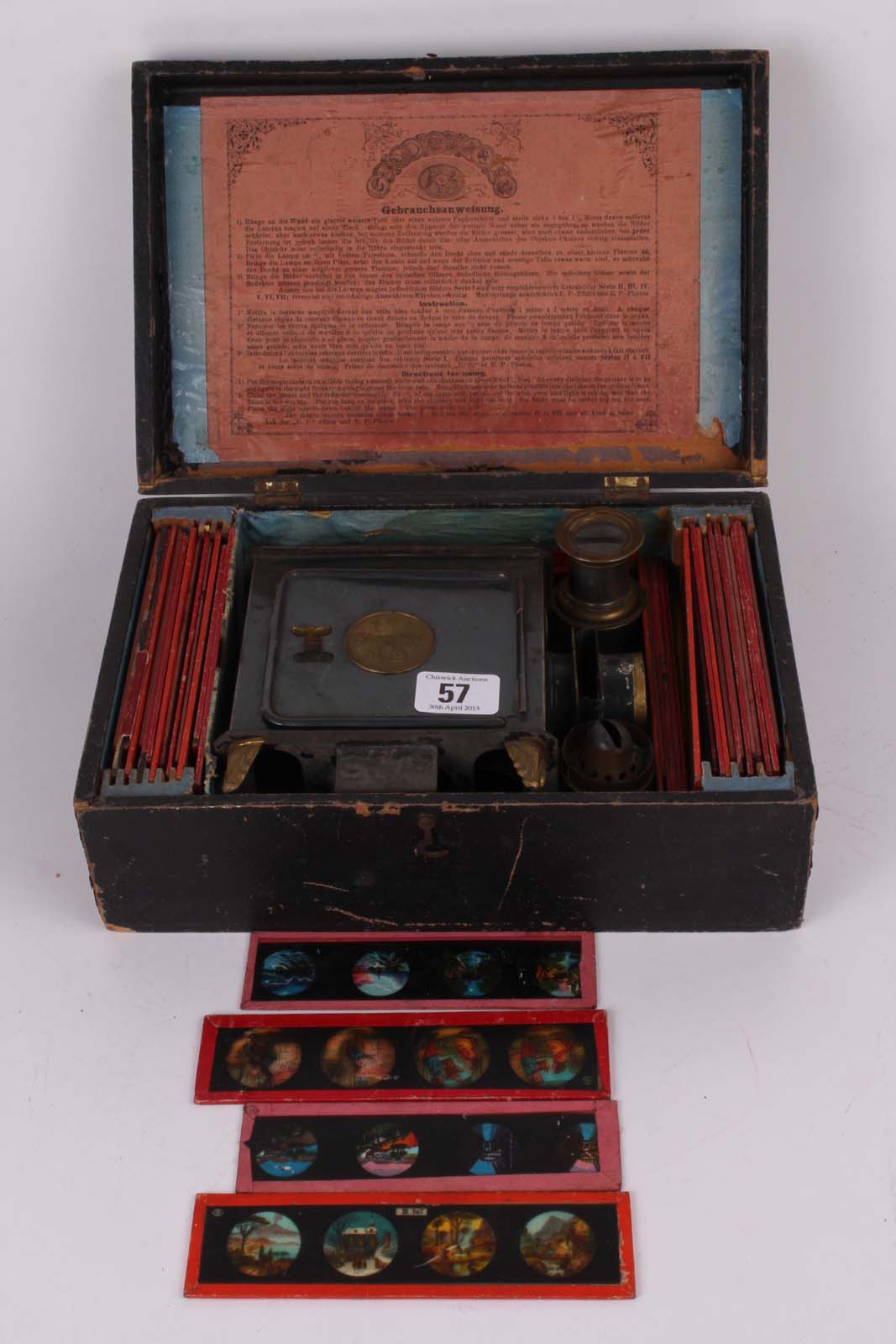 A Victorian boxed Magic Lantern with glass slides and instructions by Standard E.P. with E.P.