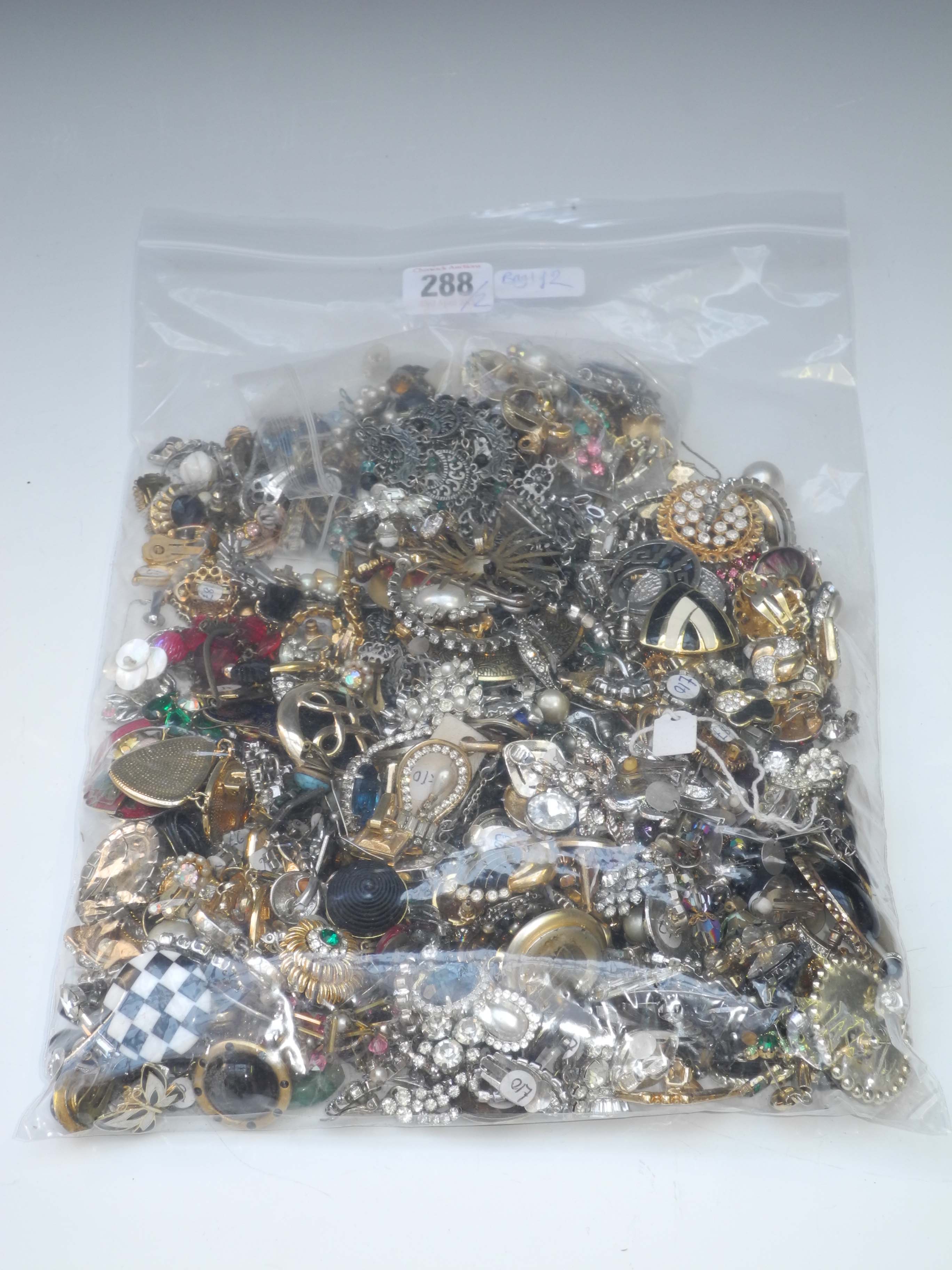 A large collection of costume jewellery (contained in two bags). (Qty).