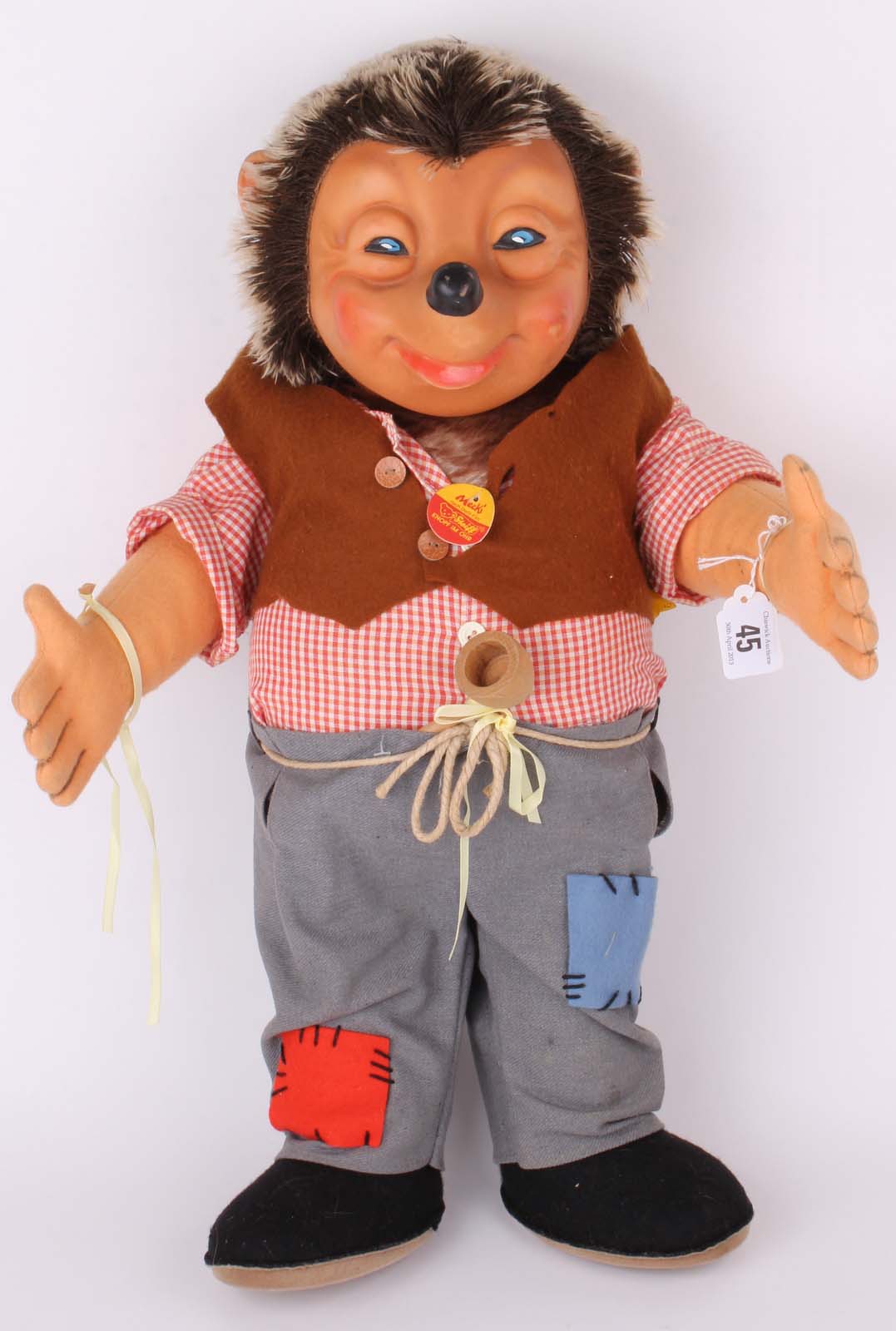 A large vintage Steiff Mecki Hedgehog, wearing tramp trousers, pipe in belt, waistcoat, with