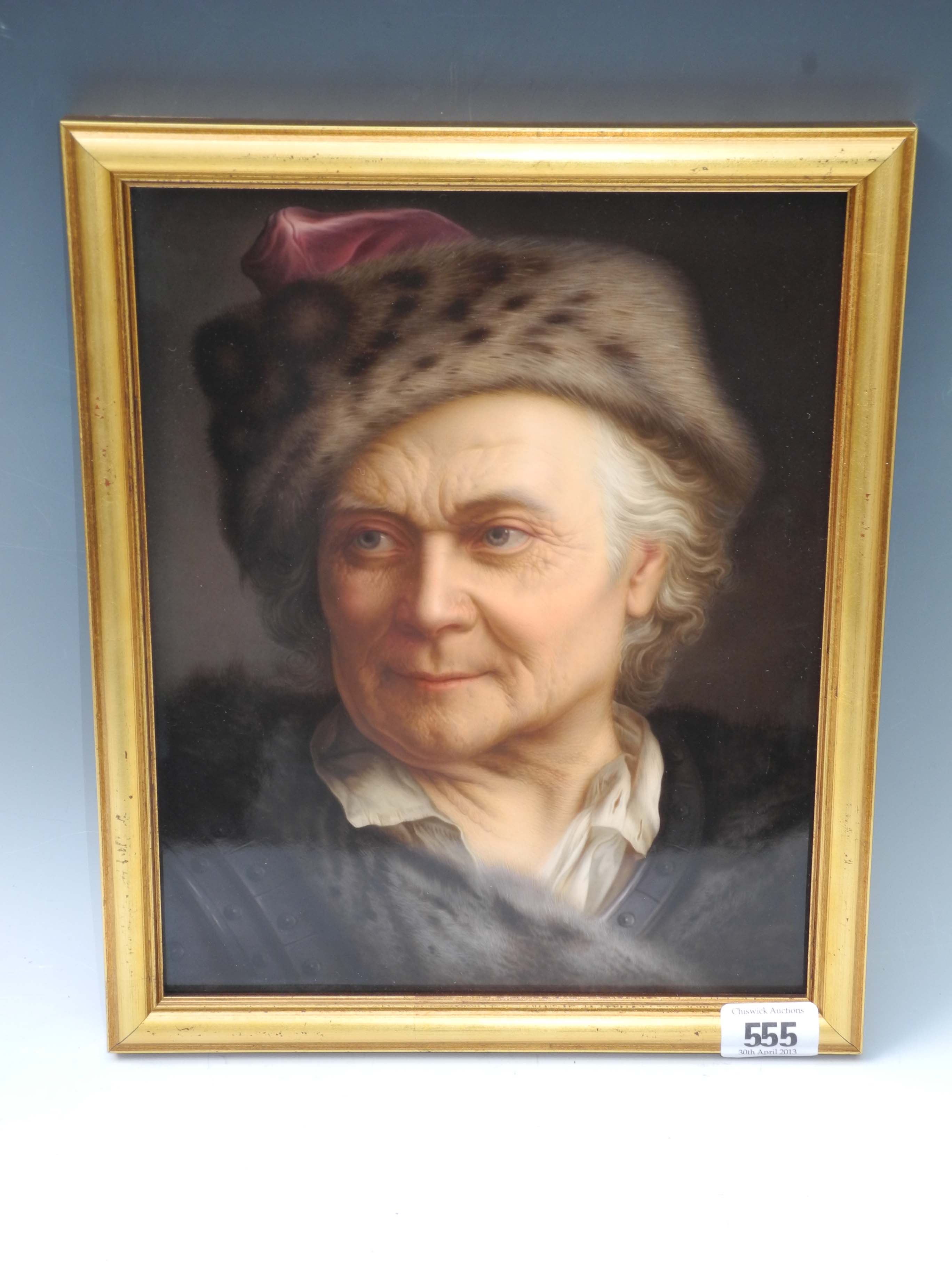 A 19th Century KPM porcelain portrait plaque of an elderly man with fur hunting cap, signed lower