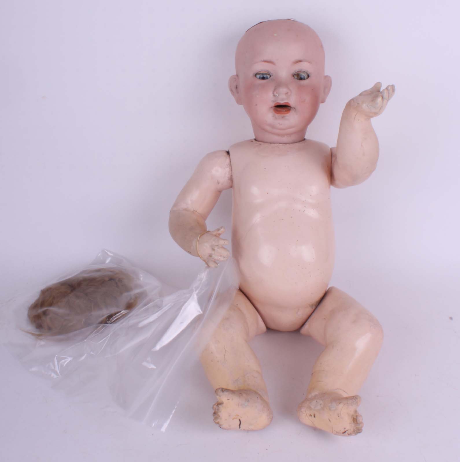 A Porzellanfabrik Mengersgereuth bisque head character baby doll, German 1910, with sleeping blue