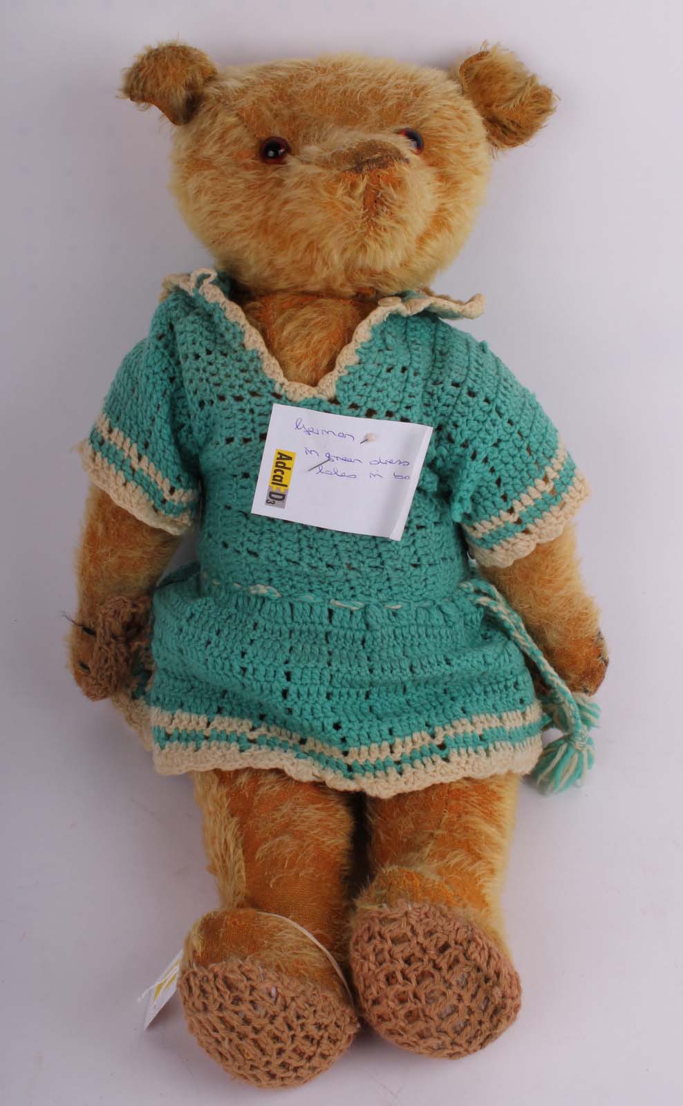 A 1920s German, short golden mohair Teddy bear, with brown glass eyes, fully jointed (knitted