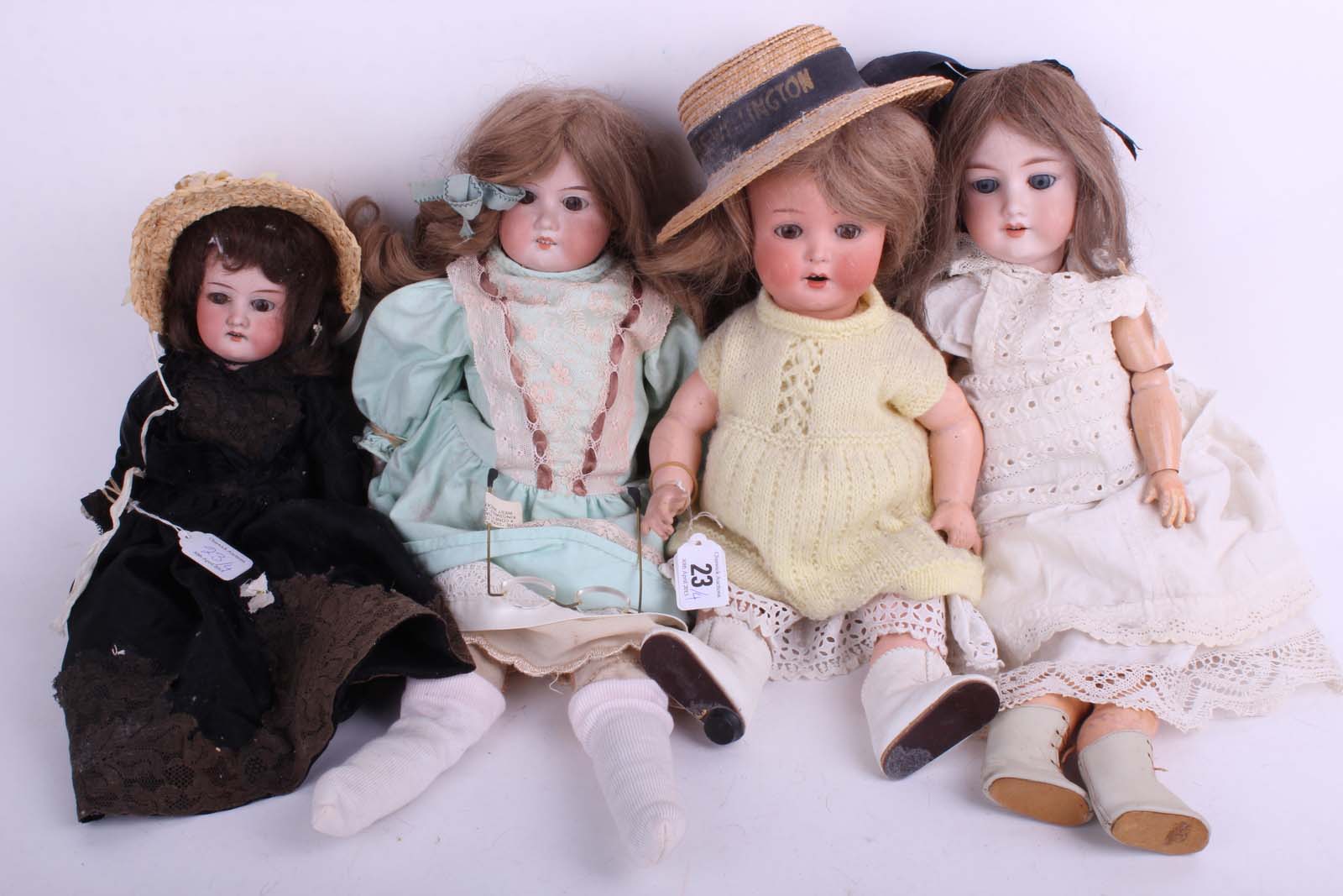Four German 1920s Armand Marseille bisque head child dolls, including AM 996 with breather nostrils,