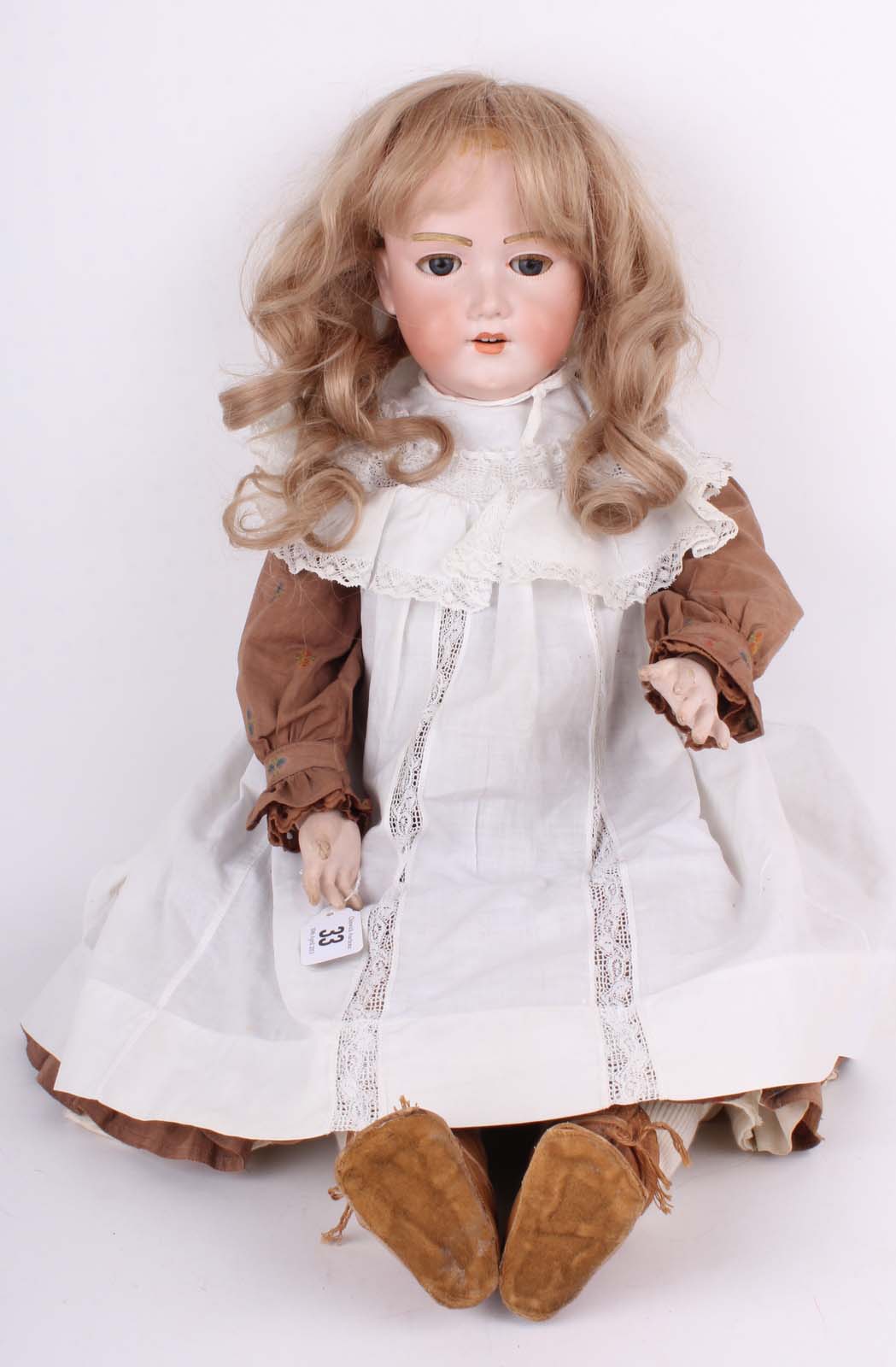 An Armand Marseille `Floradora` bisque head girl doll, German 1900s, with weighted blue glass