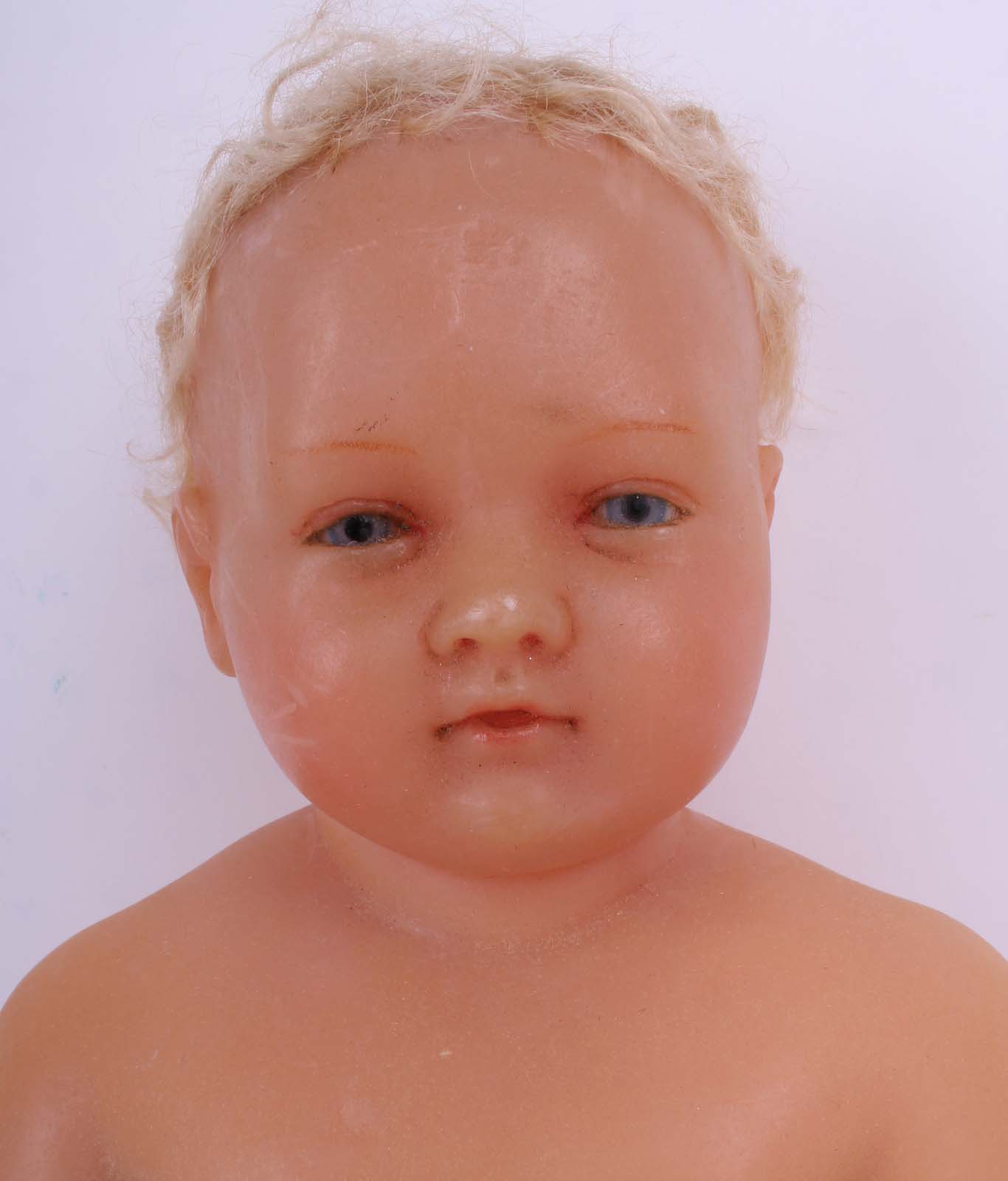 A large Pierotti poured wax child doll, English 1870s, with blue glass eyes, blonde inset hair, with