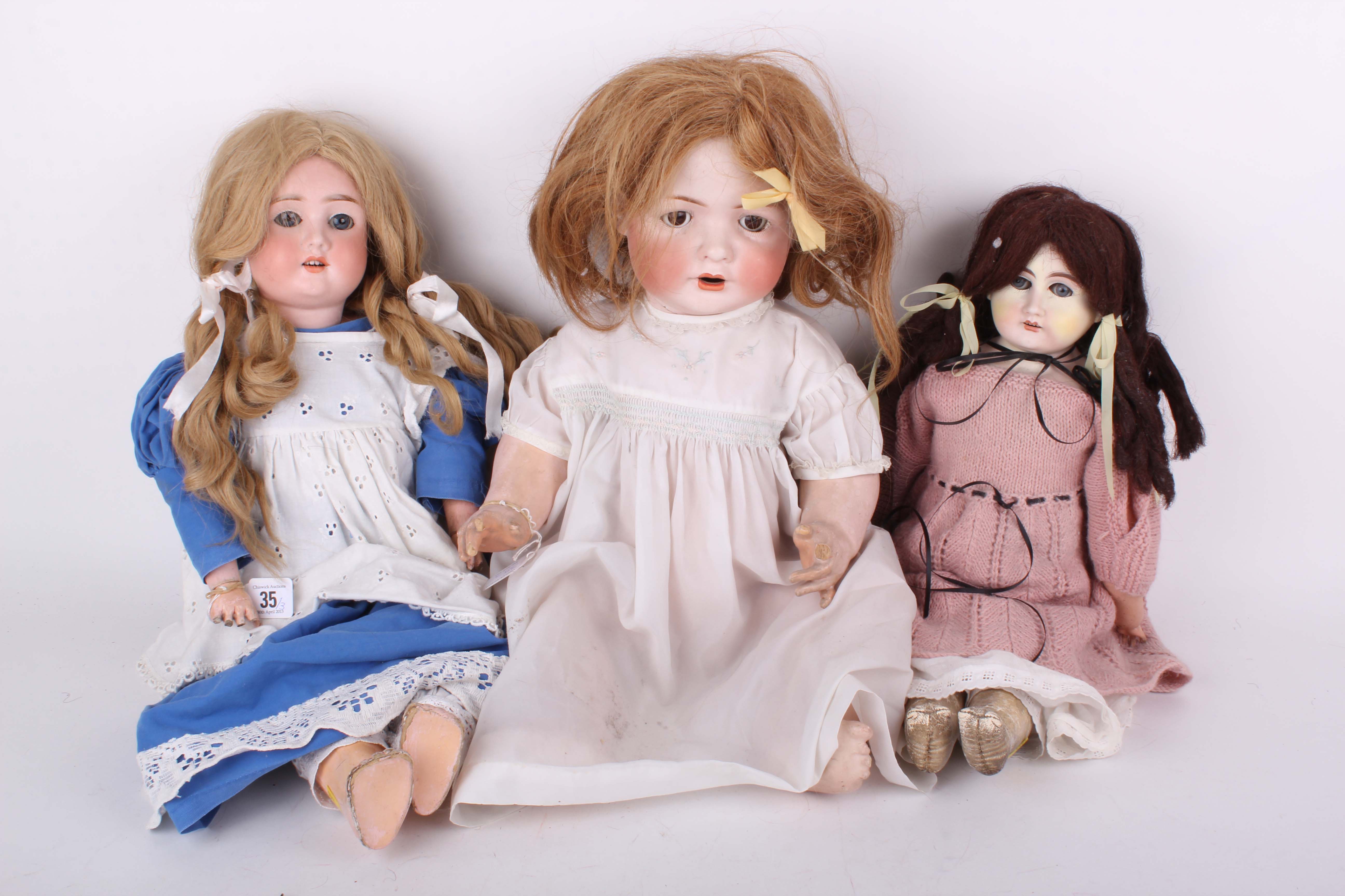 Three German 1900s bisque head dolls including a large Baer & Proeschild 535, with sleeping eyes and