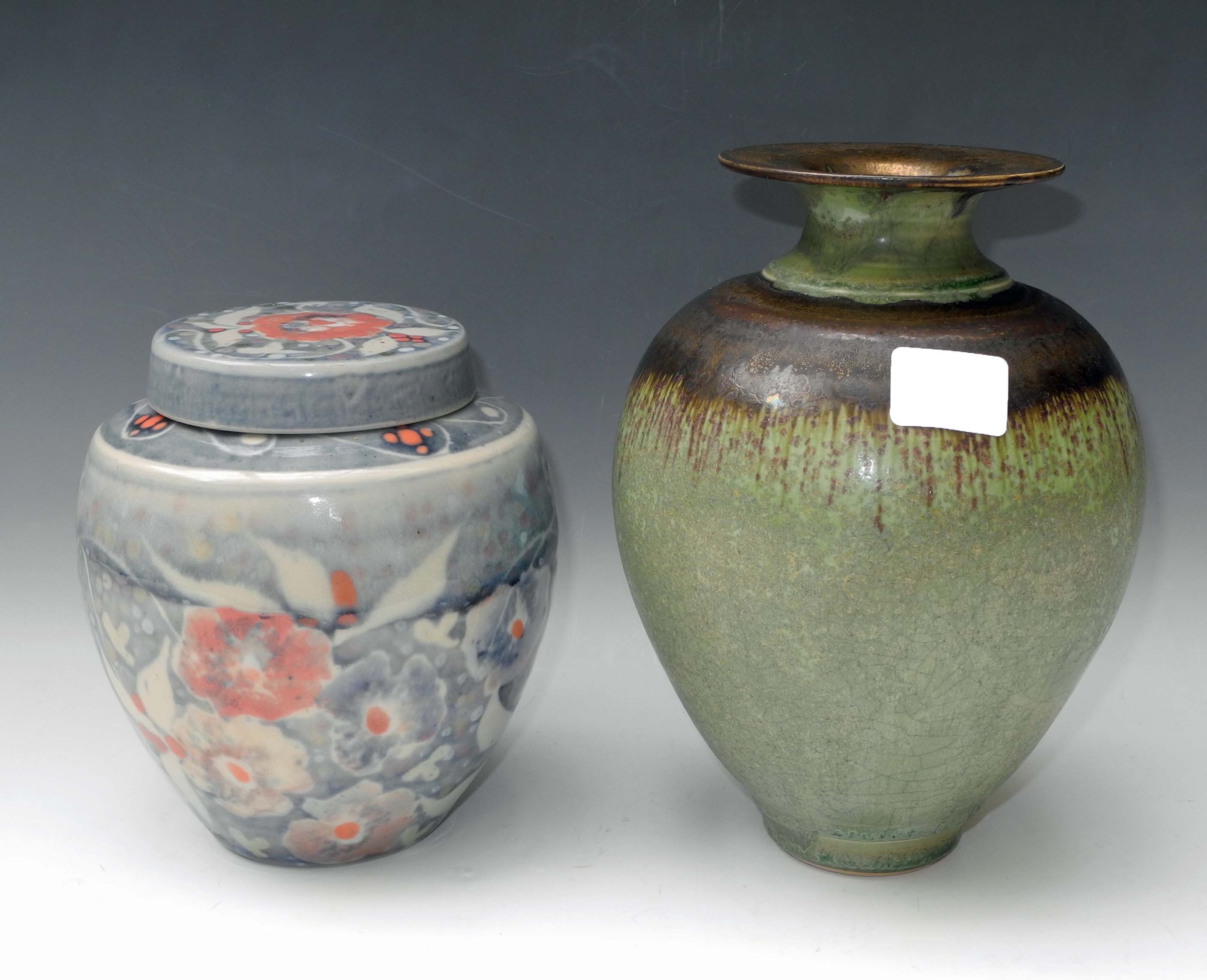 A mid 20th Century Art Pottery stoneware baluster form narrow neck vase in matt mottled green