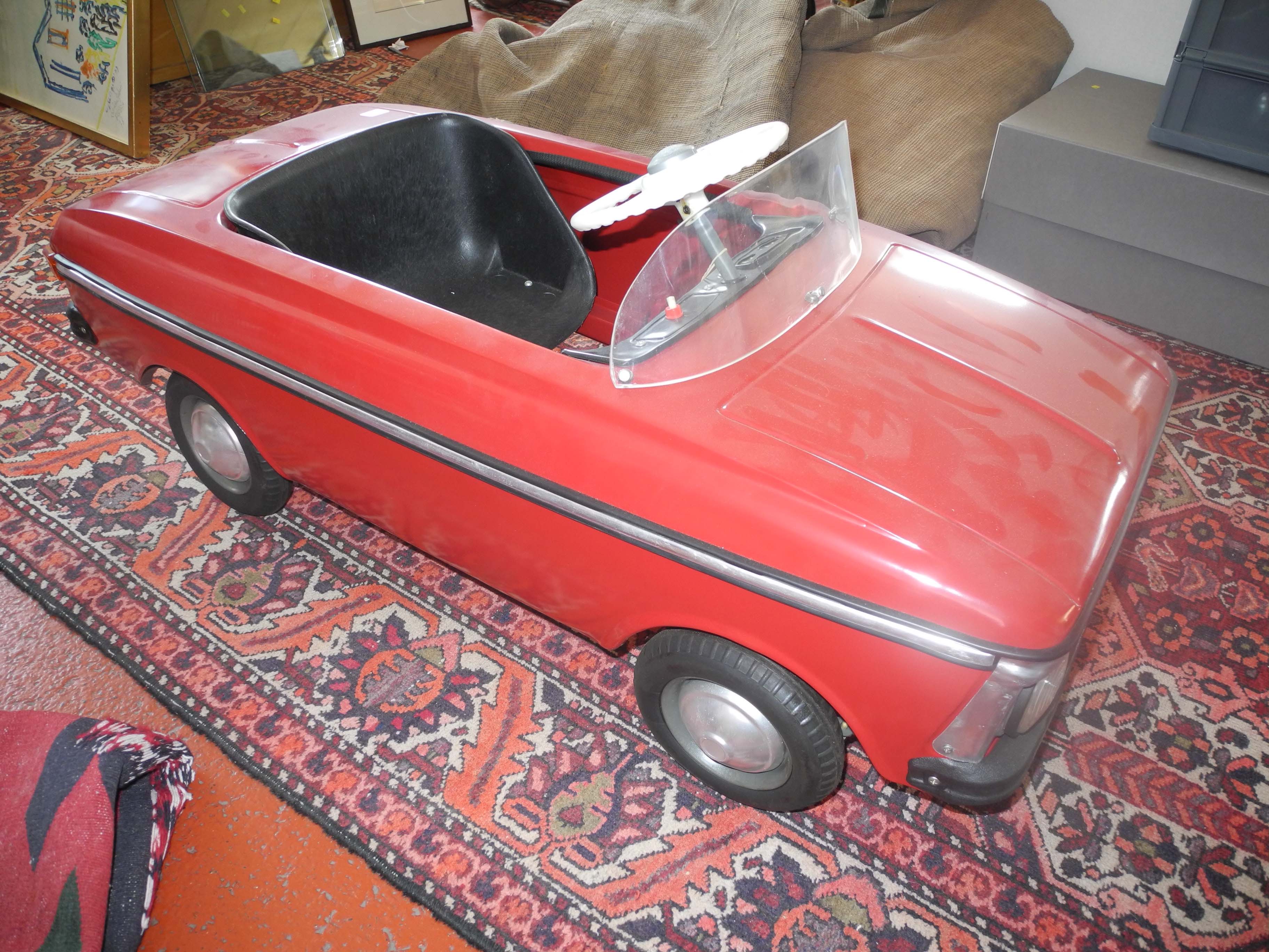 A rare vintage Moskvich, Russian red metal child`s pedal car, in mint condition, one of the last