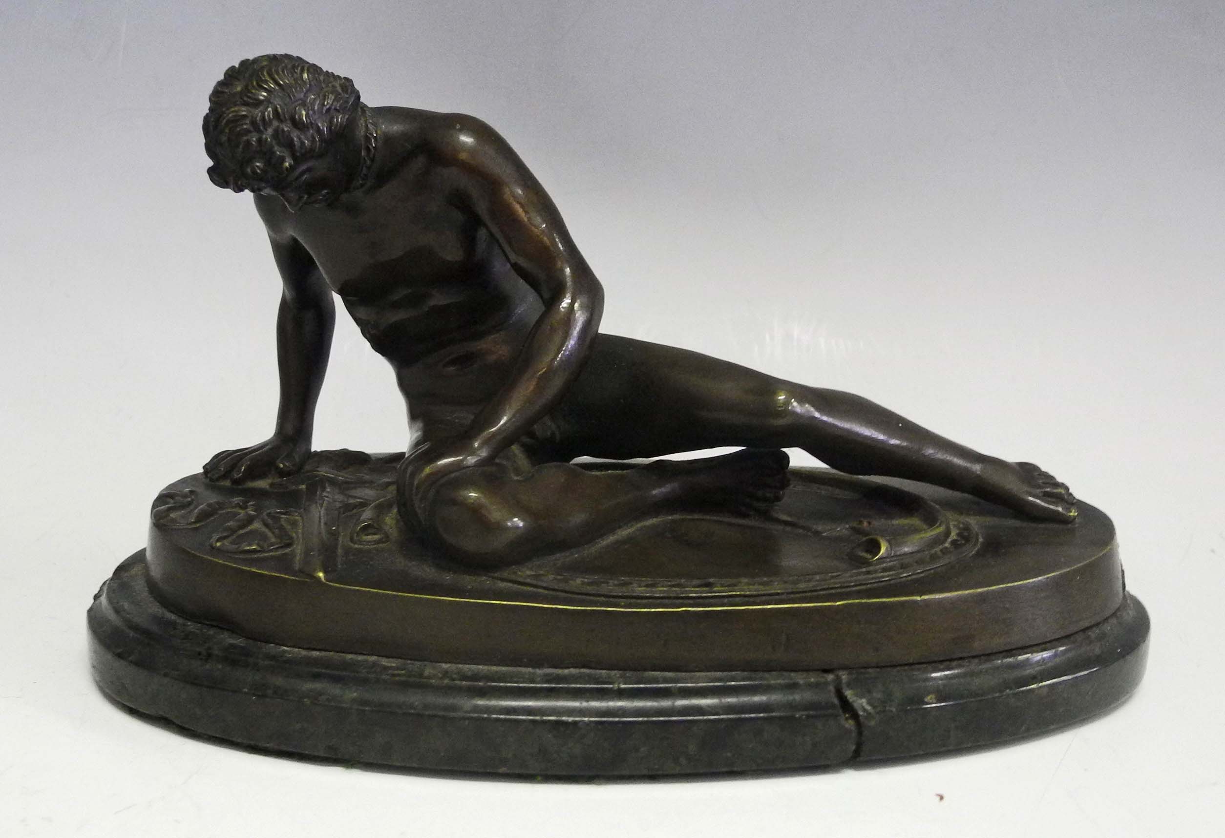 A 19th Century English bronze model of "The Dying Gaul", on oval base.