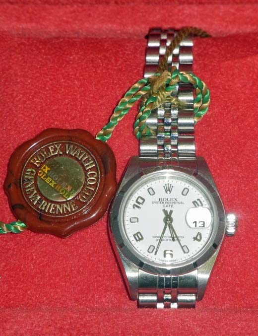 A ladies` 2004 Rolex Oyster Perpetual date wrist watch, having a white Arabic chapter dial and