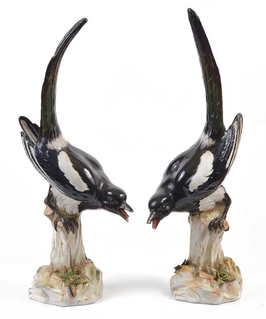 A pair of large late 19th century Meissen factory porcelain models of magpies, painted in