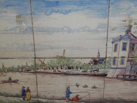 A pair of 19th century Dutch polychrome tiled plaques with river views, building, windmills in