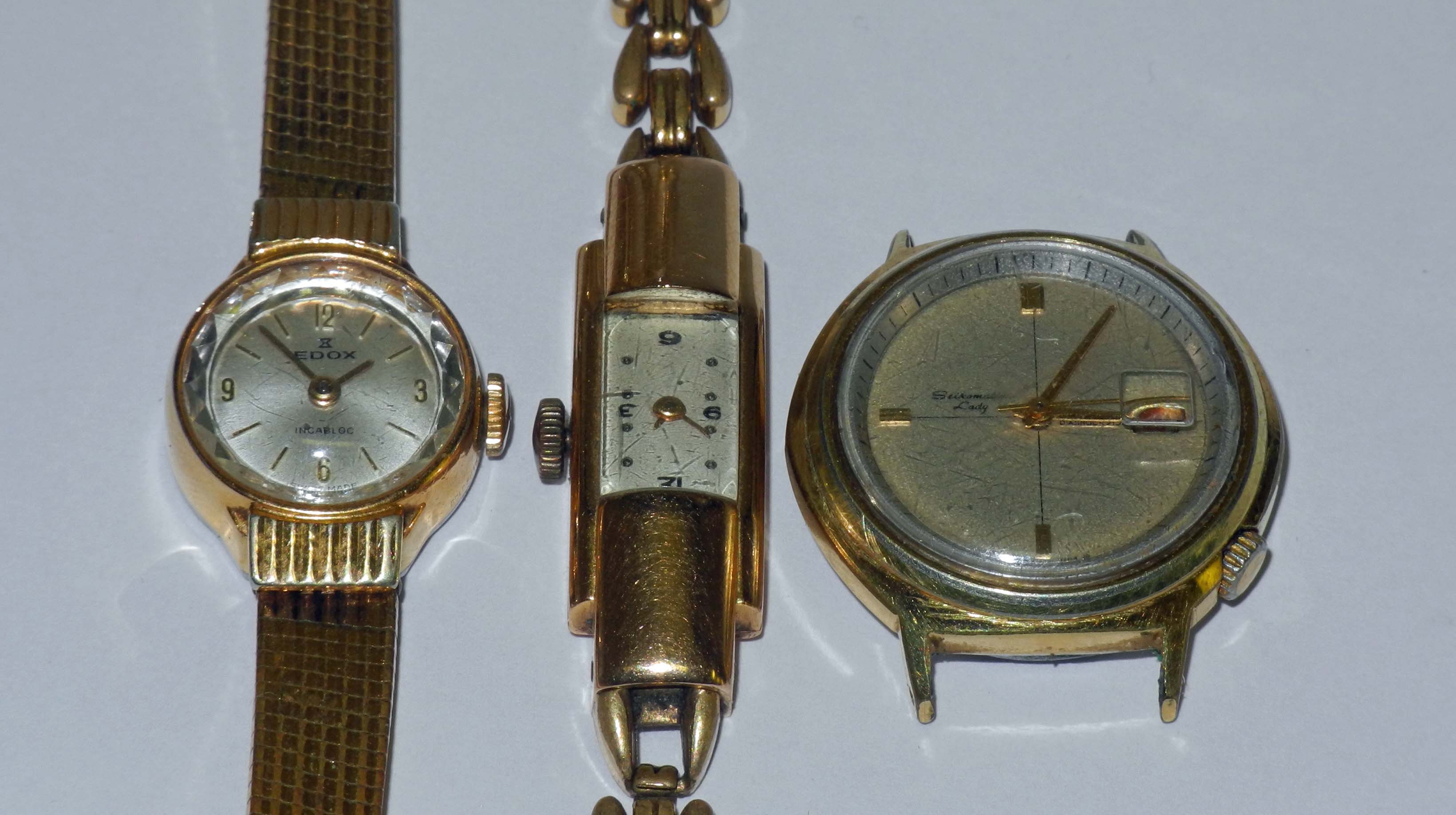 A ladies` circa 1950s 18ct gold cased Baume & Mercier lozenge dress watch, having a curved case, top