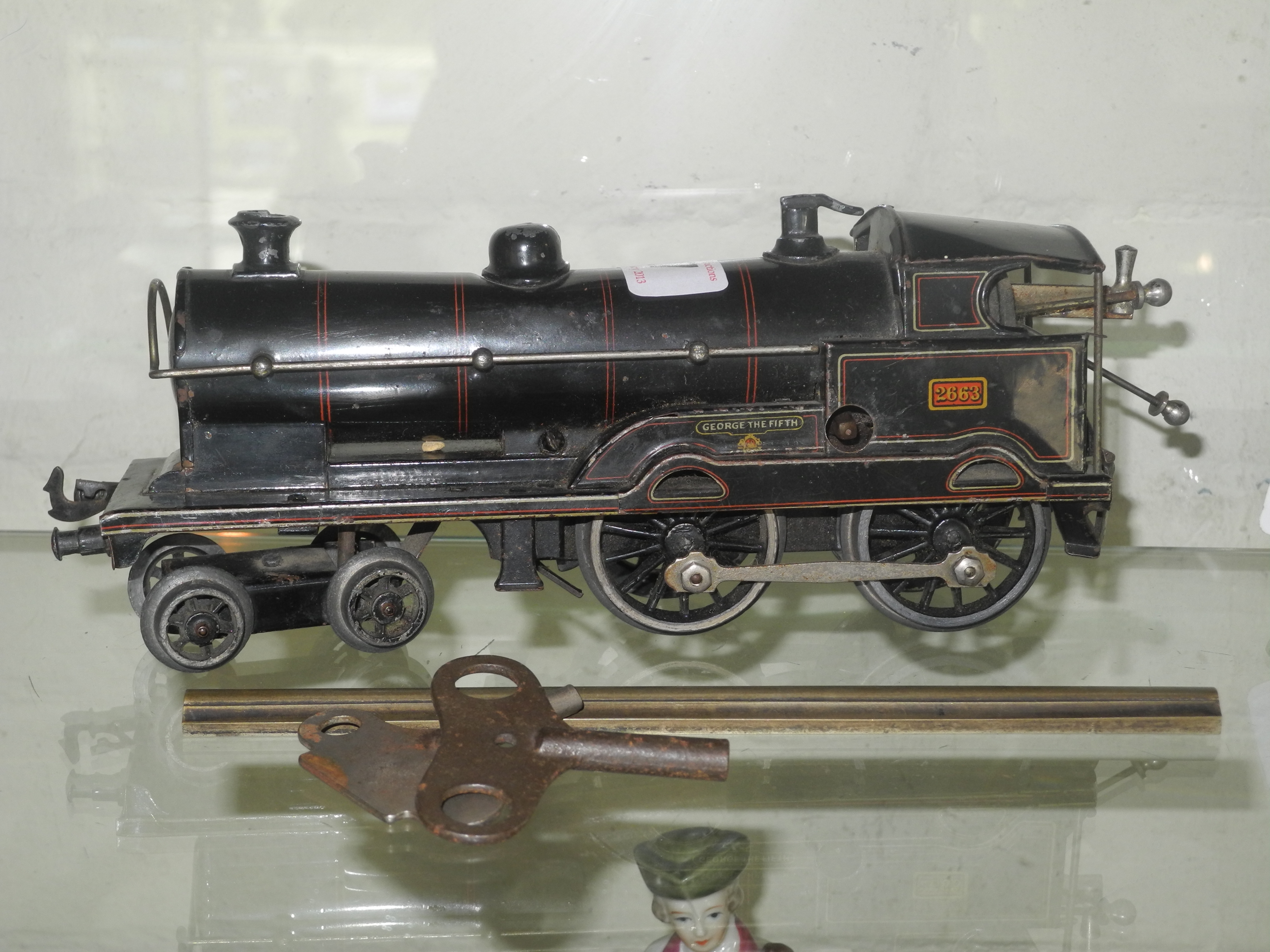 A black Hornby tin plate 0` gauge Locomotive `George the Fifth` (played with, front wheels loose),