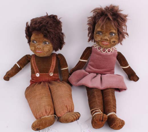 A pair of Norah Wellings South Sea Islander dolls, with velvet bodies, glass eyes and mohair wigs (