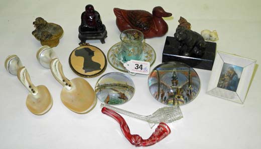 A 19th century Bohemian cut cranberry glass miniature pipe, another glass pipe, a Victorian `