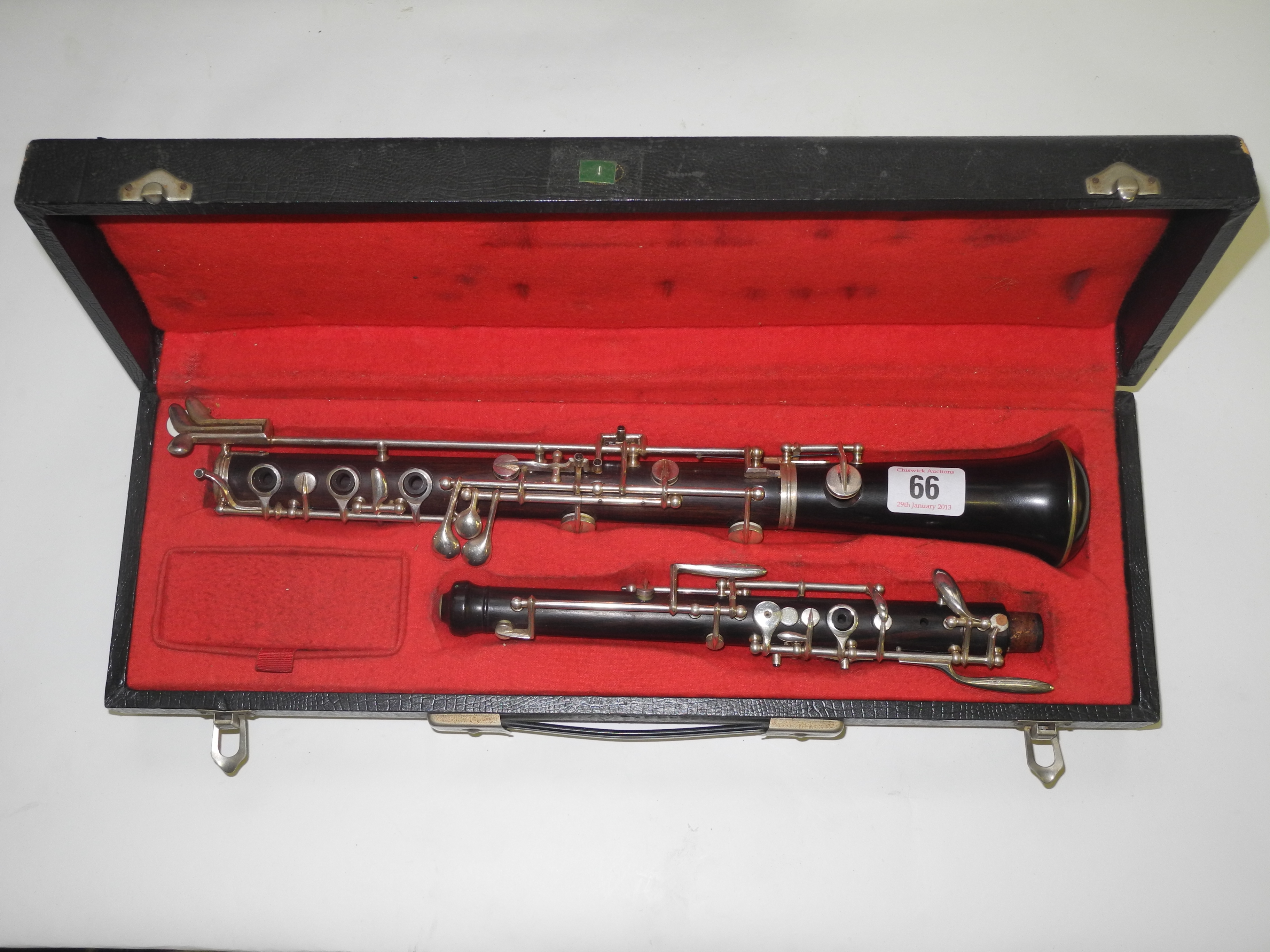 A cased Alto saxophone.