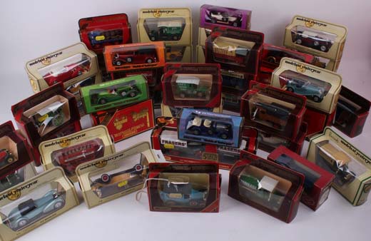 A large collection of Models of Yesteryear mint in box, various die-cast and plastic cars and