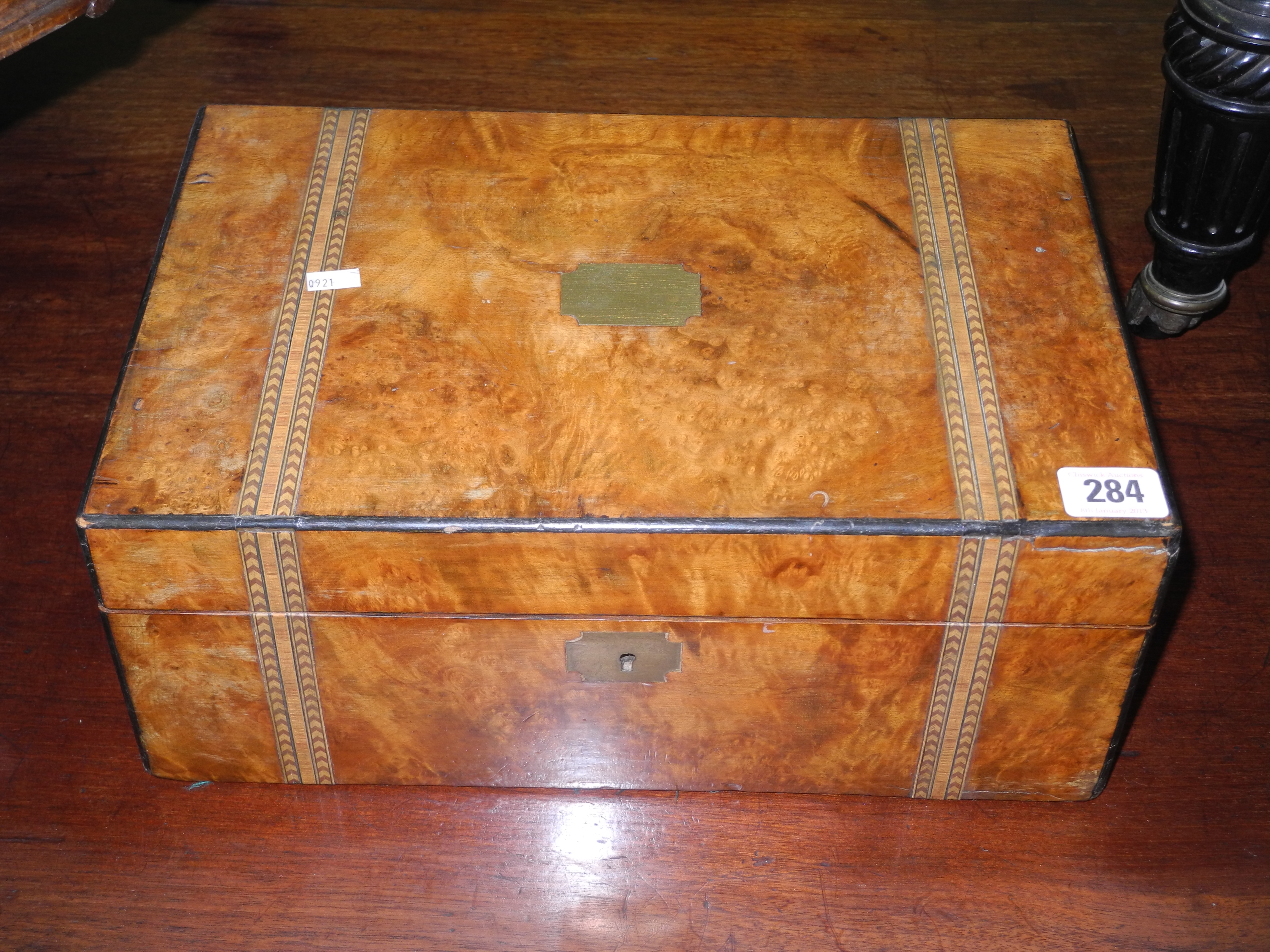 A 19th century walnut and inlaid writing slope opening to reveal a leather writing surface and