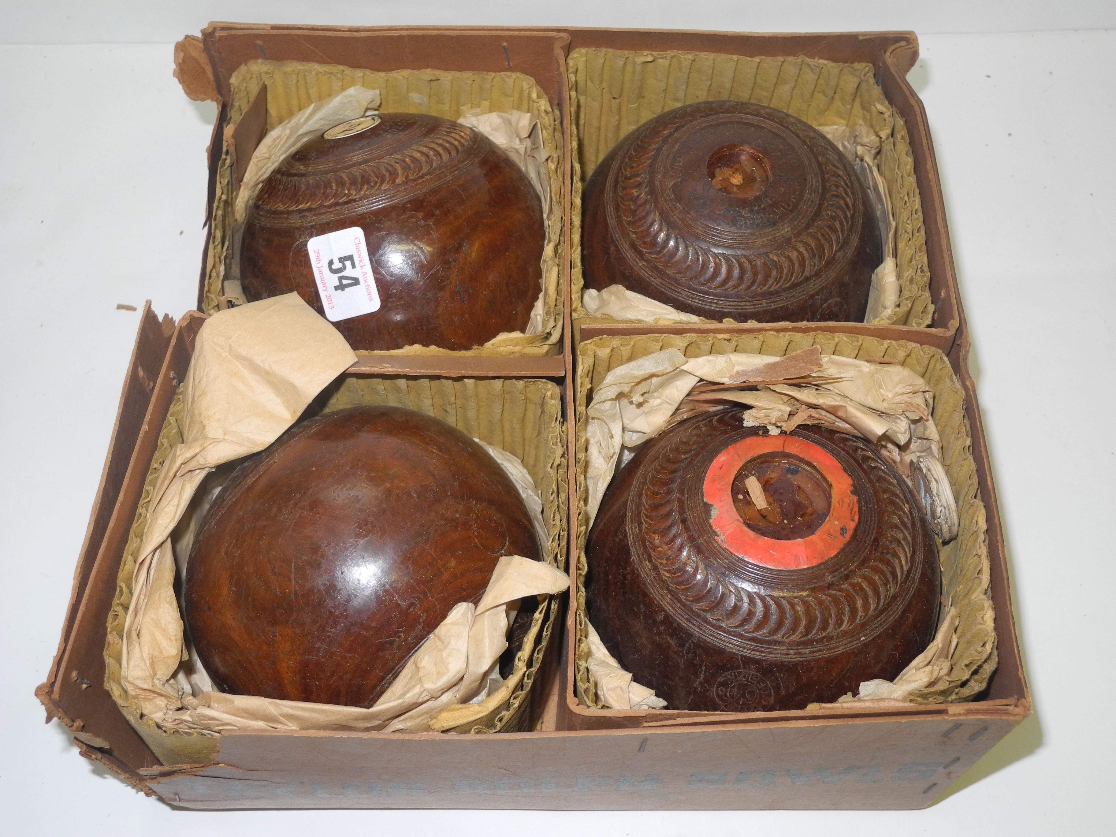 A set of four boxed lignum vitae Taylor Rolph bowls, boxed. (4)