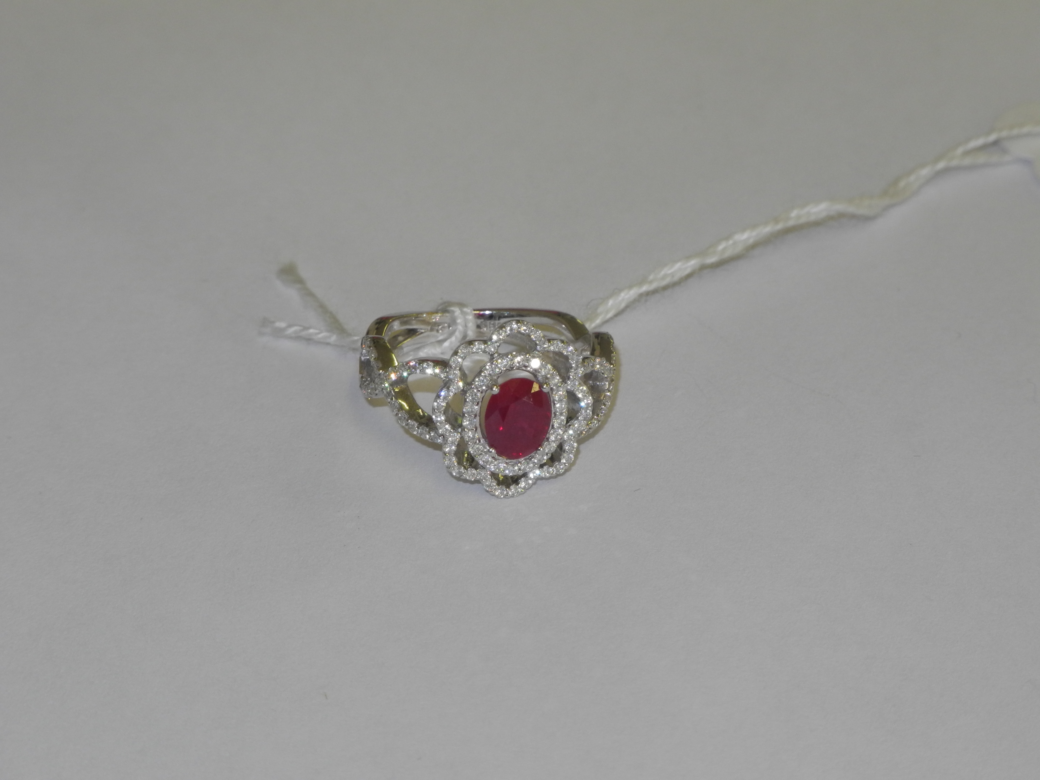 A modern 18ct white gold, ruby and diamond set fancy dress ring.