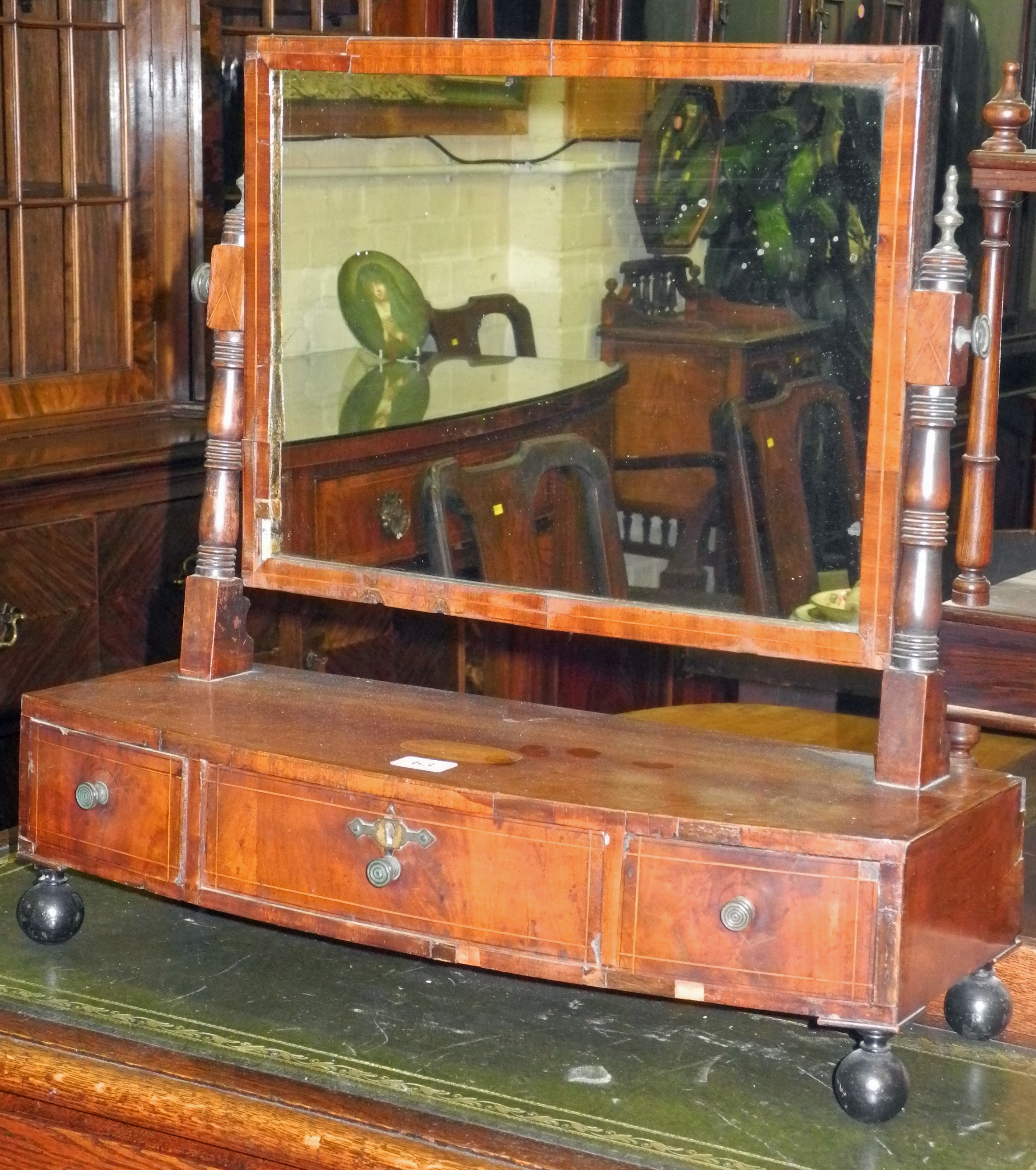 A late Victorian mahogany ladies` dressing table swing mirror, having centrally inlaid shell