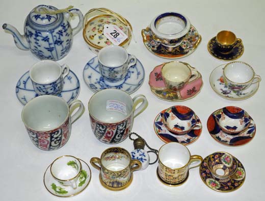 A collection of mainly early 20th century miniature cabinet cups and saucers, and tankards,