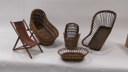 A wicker cradle on rockers, two others, a Moses basket and a deckchair