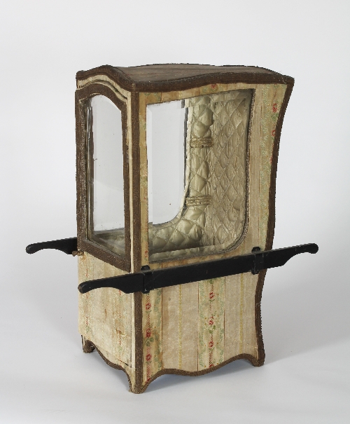 A 19th Century dolls' sedan chair with black painted shafts, the silk lined exterior with floral and