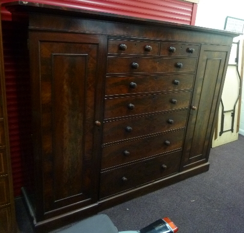 A Victorian mahogany wardrobe fitted for hanging and with six long and two short drawers, 213.