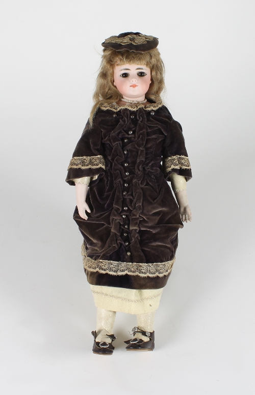 A Simon & Halbig bisque head doll, the head impressed SH6905, with weighted eyes, painted eyebrows