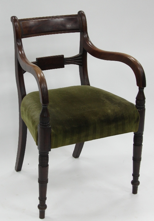 A Regency mahogany open armchair, with bar backs, the downswept arms on turned supports over