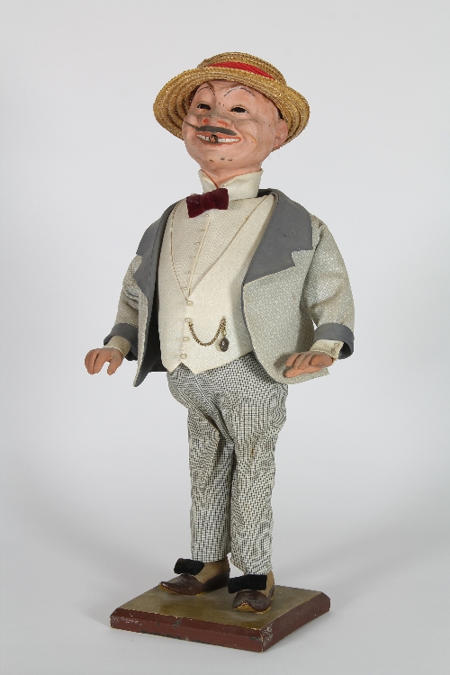 An automaton figure of an Italian señor, his head rocking from left to right with moving eyes  and