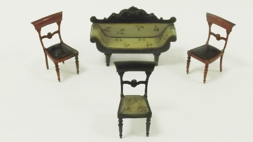 A Regency style painted tin scroll end sofa and three Regency dining chairs