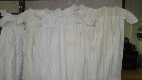 Eight Edwardian and later dolls'/children's dresses, Christening robes, etc.