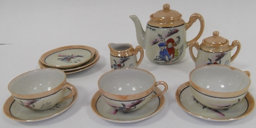 A dolls' Continental tea service of fourteen pieces, 'Here We Go'